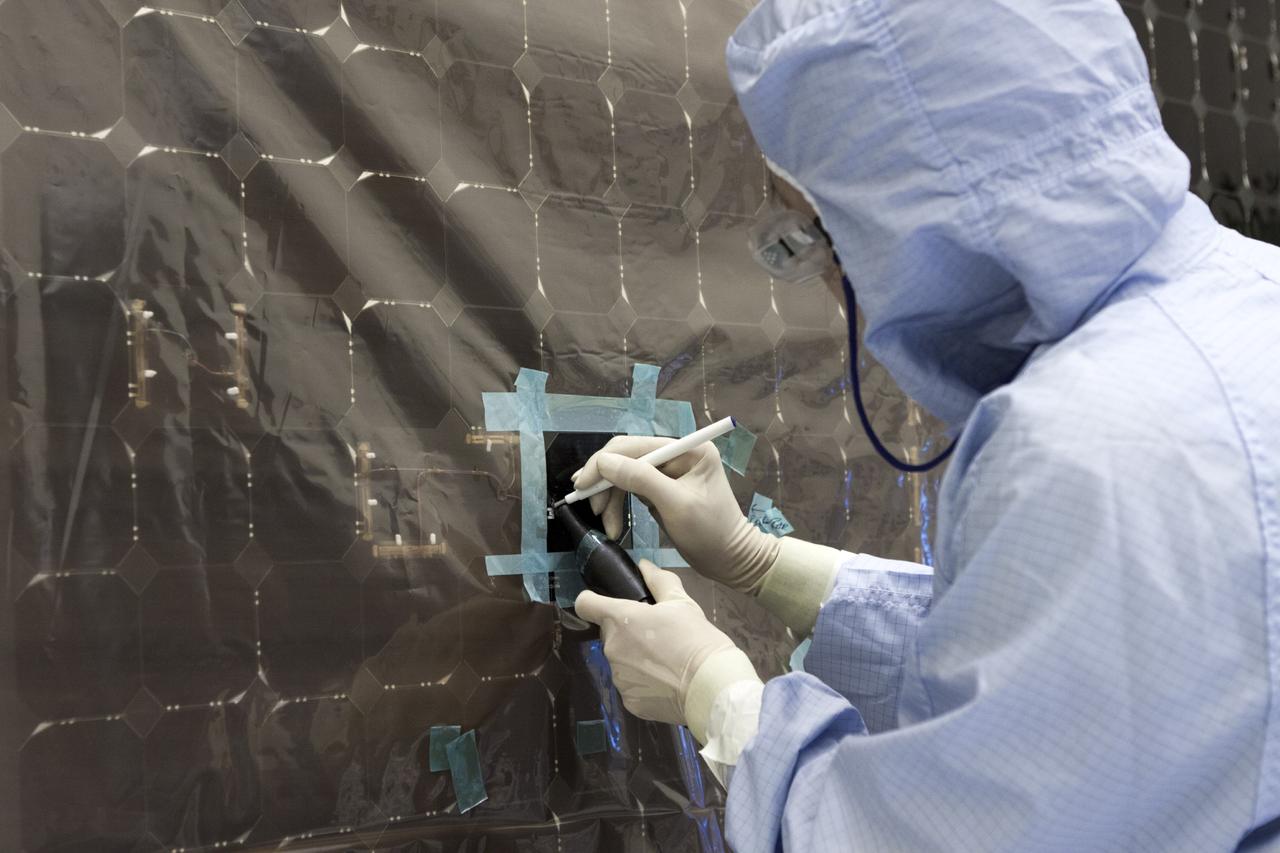 CAPE CANAVERAL, Fla. – Inside the Payload Hazardous Servicing Facility at NASA's Kennedy Space Center in Florida, a technician repairs a cell from one of the electricity-producing solar arrays for the Mars Atmosphere and Volatile Evolution, or MAVEN, spacecraft. MAVEN is being prepared for its scheduled launch in November from Cape Canaveral Air Force Station, Fla. atop a United Launch Alliance Atlas V rocket. Positioned in an orbit above the Red Planet, MAVEN will study the upper atmosphere of Mars in unprecedented detail. For more information, visit: http://www.nasa.gov/mission_pages/maven/main/index.html Photo credit: NASA/Jim Grossmann MAVEN is being prepared inside the facility for its scheduled November launch aboard a United Launch Alliance Atlas V rocket to Mars. Positioned in an orbit above the Red Planet, MAVEN will study the upper atmosphere of Mars in unprecedented detail. Photo credit: NASA/Jim Grossmann