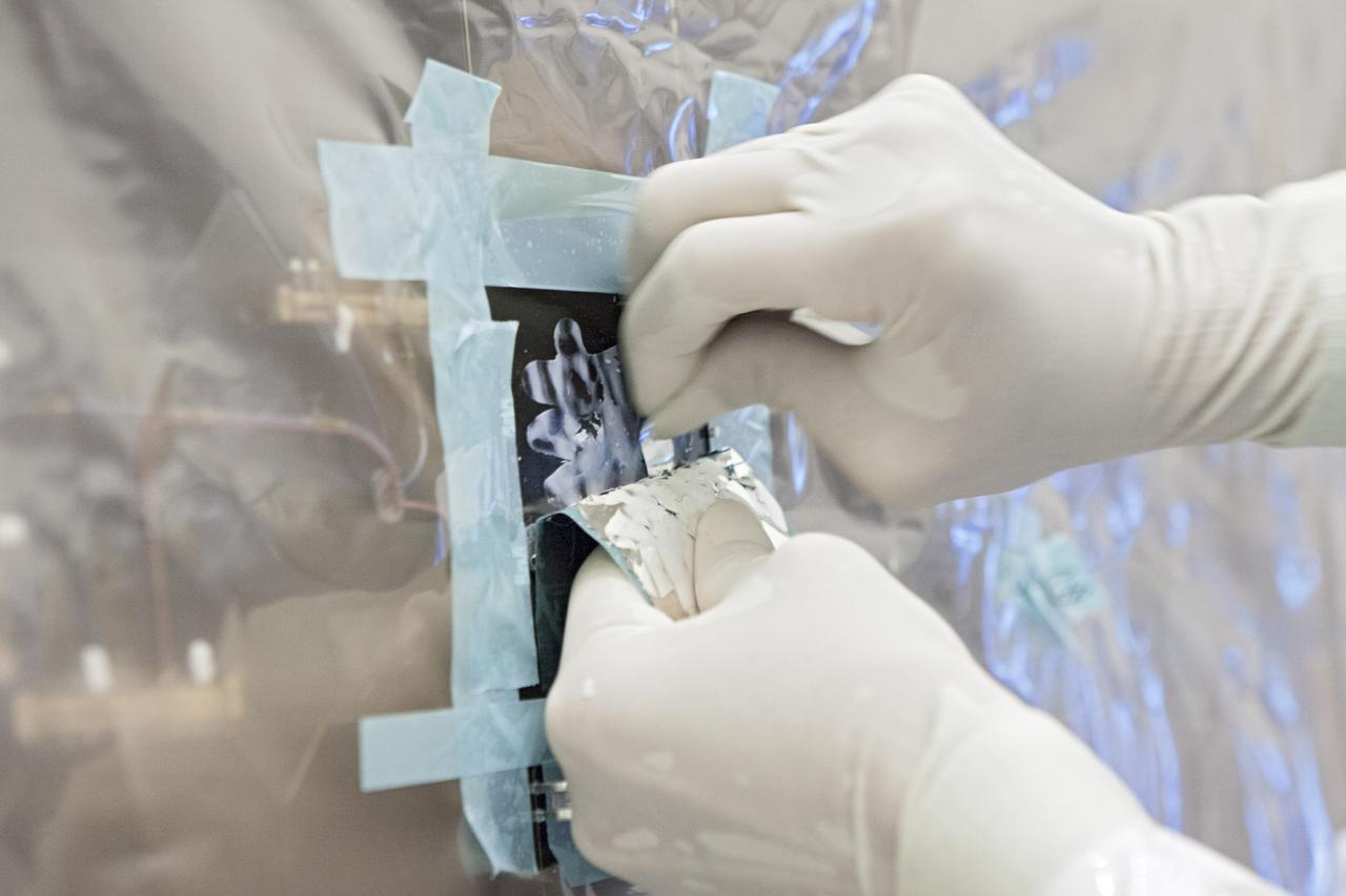 CAPE CANAVERAL, Fla. – Inside the Payload Hazardous Servicing Facility at NASA's Kennedy Space Center in Florida, a technician cleans a cell from one of the electricity-producing solar arrays for the Mars Atmosphere and Volatile Evolution, or MAVEN, spacecraft. MAVEN is being prepared for its scheduled launch in November from Cape Canaveral Air Force Station, Fla. atop a United Launch Alliance Atlas V rocket. Positioned in an orbit above the Red Planet, MAVEN will study the upper atmosphere of Mars in unprecedented detail. For more information, visit: http://www.nasa.gov/mission_pages/maven/main/index.html Photo credit: NASA/Jim Grossmann MAVEN is being prepared inside the facility for its scheduled November launch aboard a United Launch Alliance Atlas V rocket to Mars. Positioned in an orbit above the Red Planet, MAVEN will study the upper atmosphere of Mars in unprecedented detail. Photo credit: NASA/Jim Grossmann