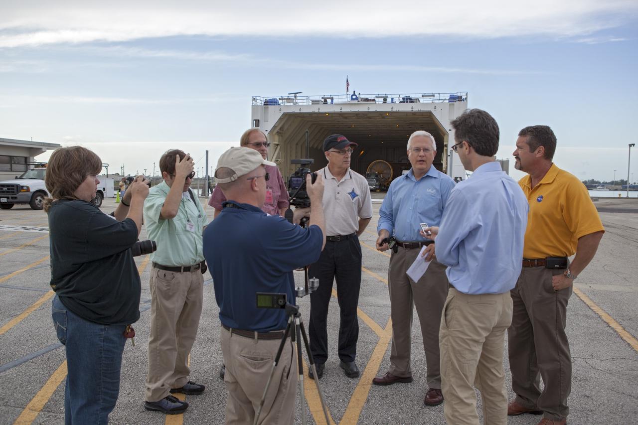 PORT CANAVERAL, Fla. – At Port Canaveral, Fla., NASA and United Launch Alliance managers brief members of the news media on the arrival of the ULA Atlas V rocket that will boost the Mars Atmosphere and Volatile Evolution, or MAVEN, spacecraft to the Red Planet. From the left, are Chuck Tatro, NASA's MAVEN mission manager, Vernon Thorp, ULA's NASA and Commercial Program manager and Omar Baez, NASA's launch director.      MAVEN is being prepared for its scheduled launch in November from Cape Canaveral Air Force Station, Fla. atop a United Launch Alliance Atlas V rocket. Positioned in an orbit above the Red Planet, MAVEN will study the upper atmosphere of Mars in unprecedented detail. For more information, visit: http://www.nasa.gov/mission_pages/maven/main/index.html Photo credit: NASA/ Dimitri Gerondidakis
