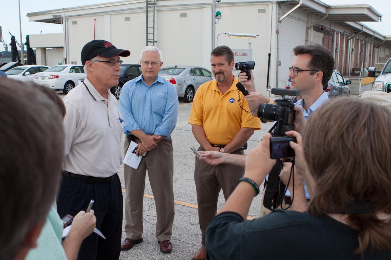 PORT CANAVERAL, Fla. – At Port Canaveral, Fla., NASA and United Launch Alliance managers brief members of the news media on the arrival of the ULA Atlas V rocket that will boost the Mars Atmosphere and Volatile Evolution, or MAVEN, spacecraft to the Red Planet. From the left, are Chuck Tatro, NASA's MAVEN mission manager, Vernon Thorp, ULA's NASA and Commercial Program manager and Omar Baez, NASA's launch director.      MAVEN is being prepared for its scheduled launch in November from Cape Canaveral Air Force Station, Fla. atop a United Launch Alliance Atlas V rocket. Positioned in an orbit above the Red Planet, MAVEN will study the upper atmosphere of Mars in unprecedented detail. For more information, visit: http://www.nasa.gov/mission_pages/maven/main/index.html Photo credit: NASA/Kim Shiflett