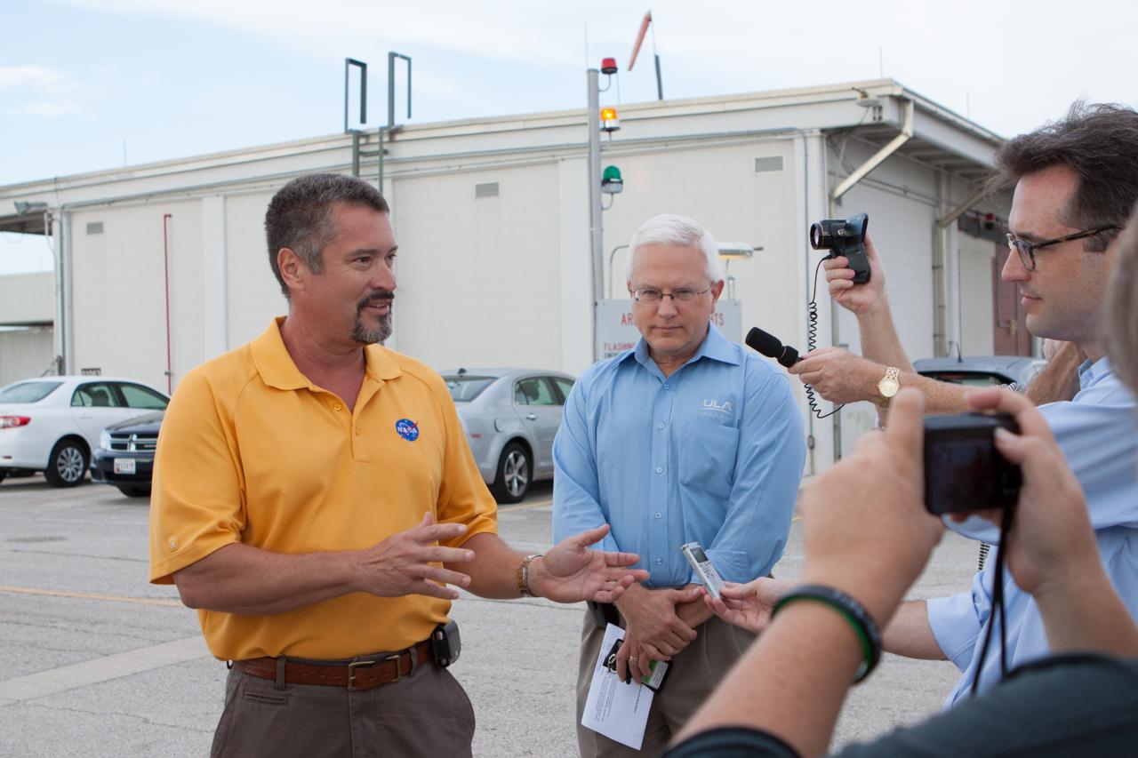 PORT CANAVERAL, Fla. – At Port Canaveral, Fla., NASA and United Launch Alliance managers brief members of the news media on the arrival of the ULA Atlas V rocket that will boost the Mars Atmosphere and Volatile Evolution, or MAVEN, spacecraft to the Red Planet. From the left, are Omar Baez, NASA's launch director, and Vernon Thorp, ULA's NASA and Commercial Program manager.      MAVEN is being prepared for its scheduled launch in November from Cape Canaveral Air Force Station, Fla. atop a United Launch Alliance Atlas V rocket. Positioned in an orbit above the Red Planet, MAVEN will study the upper atmosphere of Mars in unprecedented detail. For more information, visit: http://www.nasa.gov/mission_pages/maven/main/index.html Photo credit: NASA/Kim Shiflett