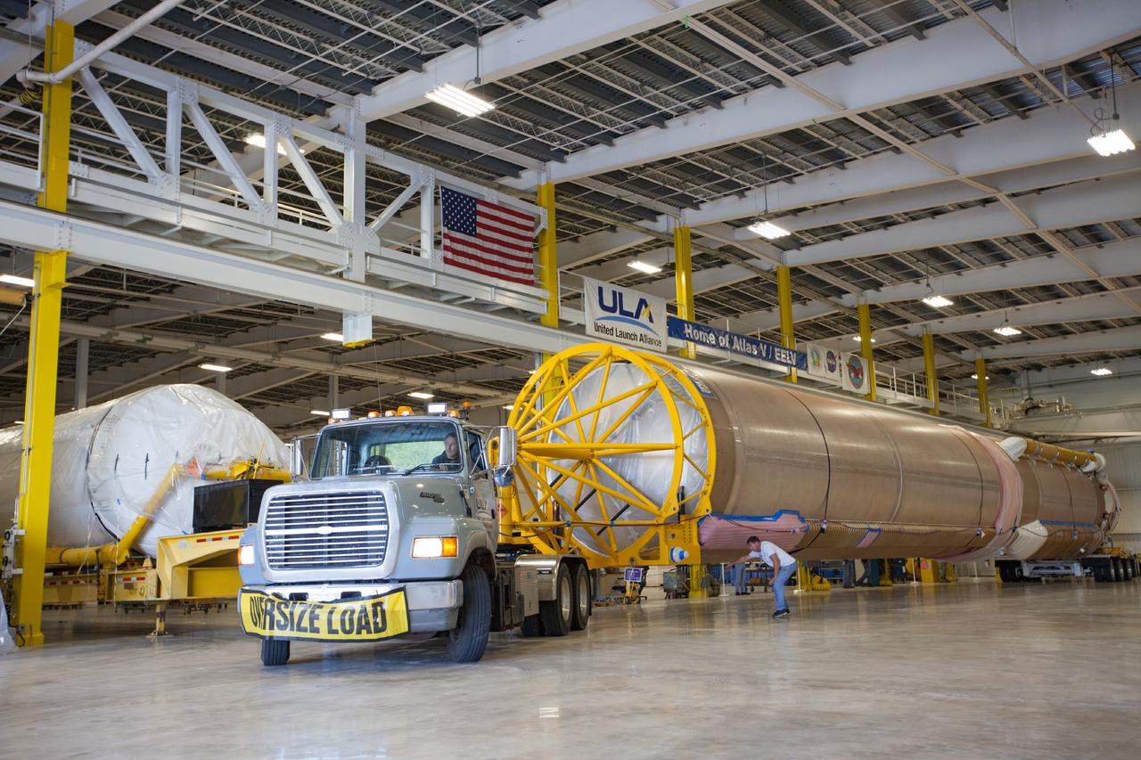 CAPE CANAVERAL, Fla. – United Launch Alliance Atlas V rocket first and second stages arrive at to the Atlas Spaceflight Operations Center, or ASOC, at Cape Canaveral Air Force Station. There, the launch vehicle will begin processing for the Mars Atmosphere and Volatile Evolution, or MAVEN, spacecraft to the Red Planet.       MAVEN is being prepared for its scheduled launch in November from Cape Canaveral Air Force Station, Fla. atop a United Launch Alliance Atlas V rocket. Positioned in an orbit above the Red Planet, MAVEN will study the upper atmosphere of Mars in unprecedented detail. For more information, visit: http://www.nasa.gov/mission_pages/maven/main/index.html Photo credit: NASA/Kim Shiflett