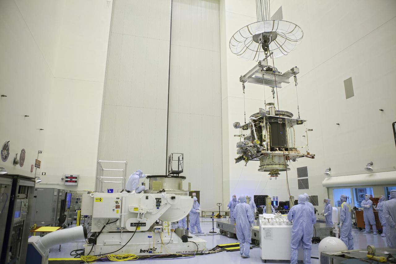 CAPE CANAVERAL, Fla. – Inside the Payload Hazardous Servicing Facility at NASA's Kennedy Space Center in Florida, technicians move the Mars Atmosphere and Volatile Evolution spacecraft, or MAVEN, toward the rotation fixture for further testing and prelaunch preparations next week. MAVEN is being readied for its scheduled November launch aboard a United Launch Alliance Atlas V rocket to Mars. Positioned in an orbit above the Red Planet, MAVEN will study the upper atmosphere of Mars in unprecedented detail. Photo credit: NASA/Chris Rhodes