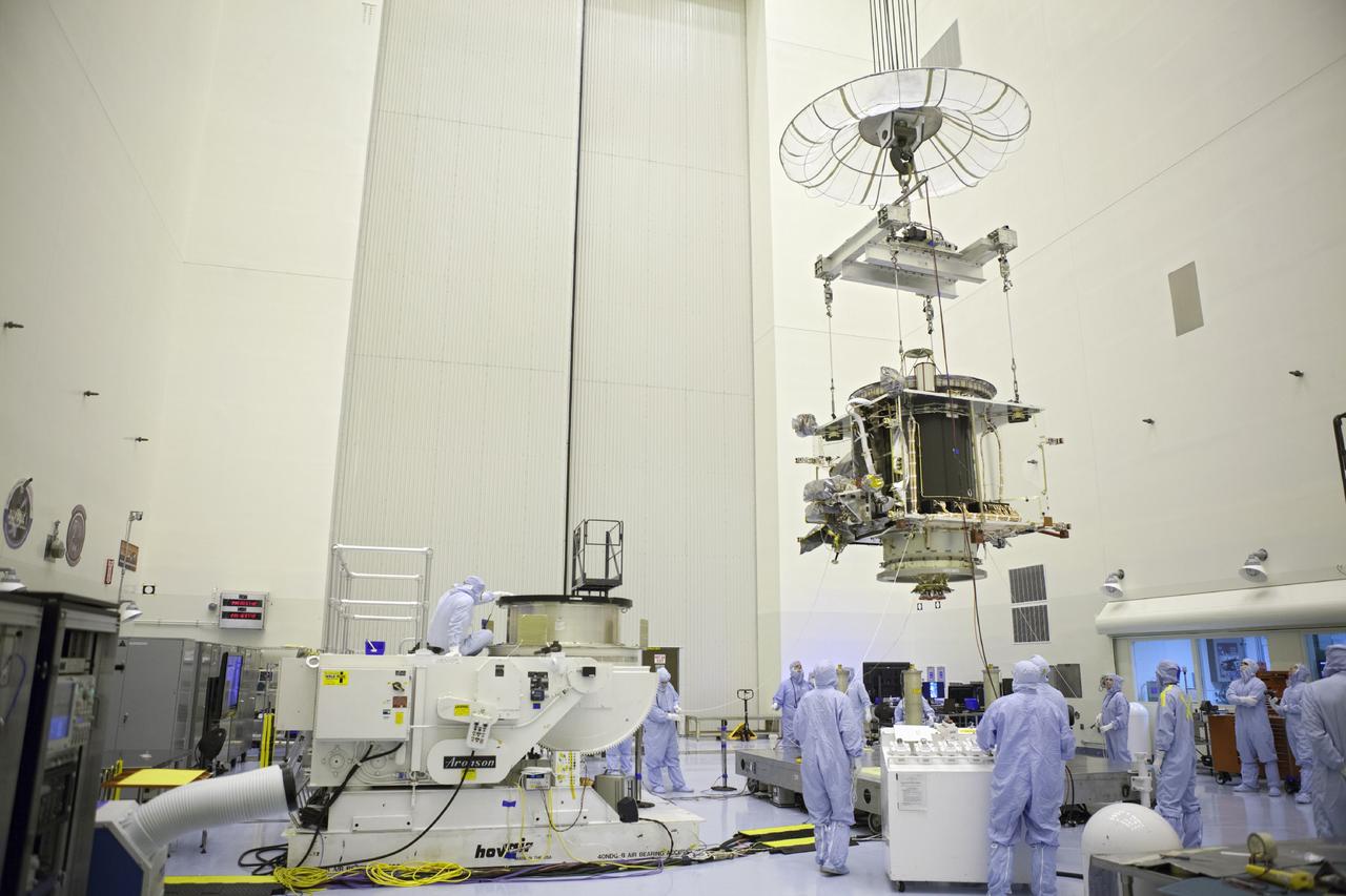 CAPE CANAVERAL, Fla. – Inside the Payload Hazardous Servicing Facility at NASA's Kennedy Space Center in Florida, technicians move the Mars Atmosphere and Volatile Evolution spacecraft, or MAVEN, toward the rotation fixture for further testing and prelaunch preparations next week. MAVEN is being readied for its scheduled November launch aboard a United Launch Alliance Atlas V rocket to Mars. Positioned in an orbit above the Red Planet, MAVEN will study the upper atmosphere of Mars in unprecedented detail. Photo credit: NASA/Chris Rhodes