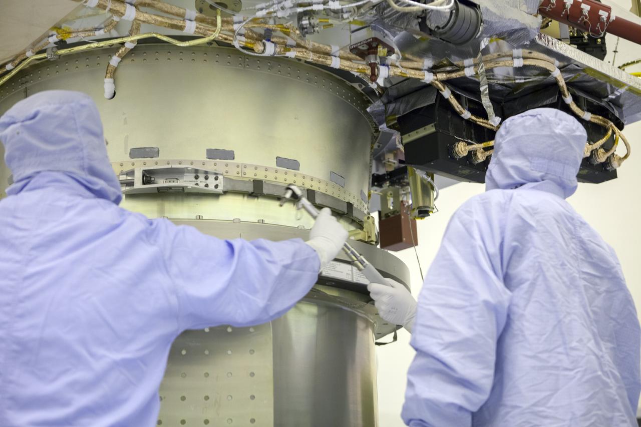 CAPE CANAVERAL, Fla. – Inside the Payload Hazardous Servicing Facility at NASA's Kennedy Space Center in Florida, technicians attach the Mars Atmosphere and Volatile Evolution spacecraft, or MAVEN, to the rotation fixture for further testing and prelaunch preparations next week. MAVEN is being readied for its scheduled November launch aboard a United Launch Alliance Atlas V rocket to Mars. Positioned in an orbit above the Red Planet, MAVEN will study the upper atmosphere of Mars in unprecedented detail. Photo credit: NASA/Chris Rhodes