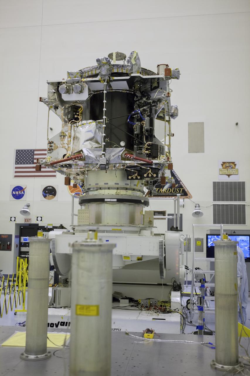 CAPE CANAVERAL, Fla. – Inside the Payload Hazardous Servicing Facility at NASA's Kennedy Space Center in Florida, the Mars Atmosphere and Volatile Evolution spacecraft, or MAVEN, stands on the rotation fixture where it will undergo further testing and prelaunch preparations next week. MAVEN is being readied for its scheduled November launch aboard a United Launch Alliance Atlas V rocket to Mars. Positioned in an orbit above the Red Planet, MAVEN will study the upper atmosphere of Mars in unprecedented detail. Photo credit: NASA/Chris Rhodes