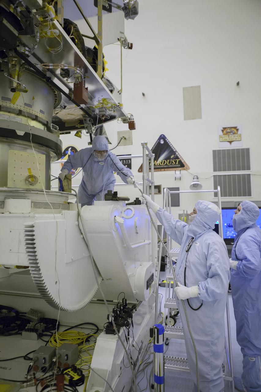 CAPE CANAVERAL, Fla. – Inside the Payload Hazardous Servicing Facility at NASA's Kennedy Space Center in Florida, technicians complete the attachment of the Mars Atmosphere and Volatile Evolution spacecraft, or MAVEN, to the rotation fixture for further testing and prelaunch preparations next week. MAVEN is being readied for its scheduled November launch aboard a United Launch Alliance Atlas V rocket to Mars. Positioned in an orbit above the Red Planet, MAVEN will study the upper atmosphere of Mars in unprecedented detail. Photo credit: NASA/Chris Rhodes