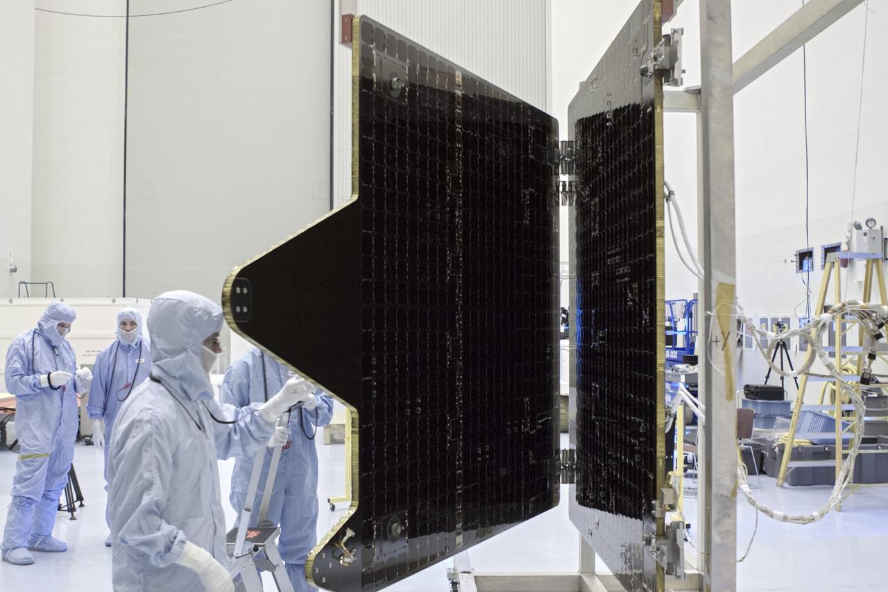 CAPE CANAVERAL, Fla. – Inside the Payload Hazardous Servicing Facility at NASA's Kennedy Space Center in Florida, technicians clean the electricity-producing solar arrays for the Mars Atmosphere and Volatile Evolution, or MAVEN, spacecraft.       MAVEN is being prepared for its scheduled launch in November from Cape Canaveral Air Force Station, Fla. atop a United Launch Alliance Atlas V rocket. Positioned in an orbit above the Red Planet, MAVEN will study the upper atmosphere of Mars in unprecedented detail. For more information, visit: http://www.nasa.gov/mission_pages/maven/main/index.html Photo credit: NASA/ Jim Grossmann