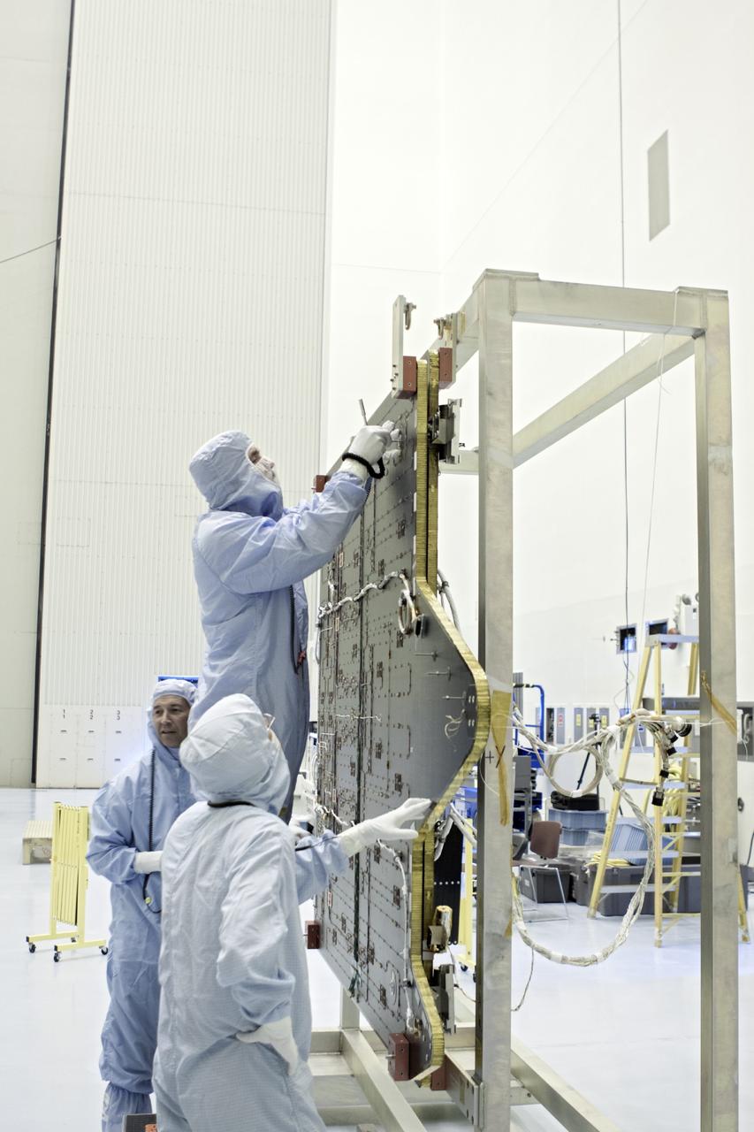 CAPE CANAVERAL, Fla. – Inside the Payload Hazardous Servicing Facility at NASA's Kennedy Space Center in Florida, technicians clean the electricity-producing solar arrays for the Mars Atmosphere and Volatile Evolution, or MAVEN, spacecraft.       MAVEN is being prepared for its scheduled launch in November from Cape Canaveral Air Force Station, Fla. atop a United Launch Alliance Atlas V rocket. Positioned in an orbit above the Red Planet, MAVEN will study the upper atmosphere of Mars in unprecedented detail. For more information, visit: http://www.nasa.gov/mission_pages/maven/main/index.html Photo credit: NASA/ Jim Grossmann