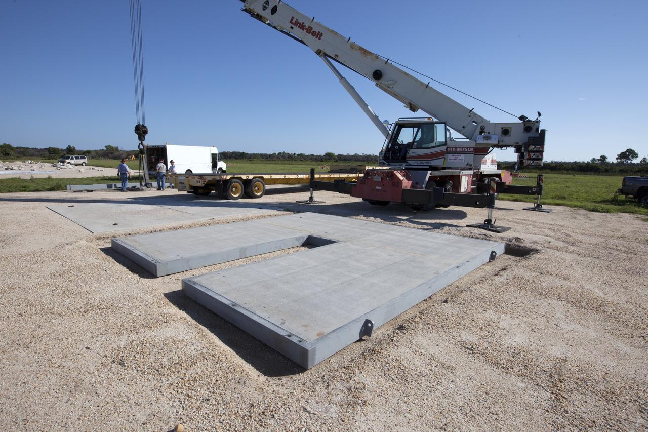 CAPE CANAVERAL, Fla. - At NASA’s Kennedy Space Center in Florida, the movable launch platform for the Project Morpheus lander is positioned on its new site adjacent to a hazard field created to support the project at the north end of the Shuttle Landing Facility, or SLF.       Testing of the prototype lander has been ongoing at NASA’s Johnson Space Center in Houston in preparation for free flight. The lander is scheduled for delivery to Kennedy in October. The SLF will provide the lander with the kind of field necessary for realistic testing, complete with rocks, craters and hazards to avoid. Morpheus utilizes an autonomous landing and hazard avoidance technology, or ALHAT, payload that will allow it to navigate to clear landing sites amidst obstacles during its descent. Project Morpheus is one of 20 small projects comprising the Advanced Exploration Systems, or AES, program in NASA’s Human Exploration and Operations Mission Directorate. AES projects pioneer new approaches for rapidly developing prototype systems, demonstrating key capabilities and validating operational concepts for future human missions beyond Earth orbit. For more information on Project Morpheus, visit http://www.nasa.gov/centers/johnson/exploration/morpheus/index.html. Photo credit: NASA/Kim Shiflett