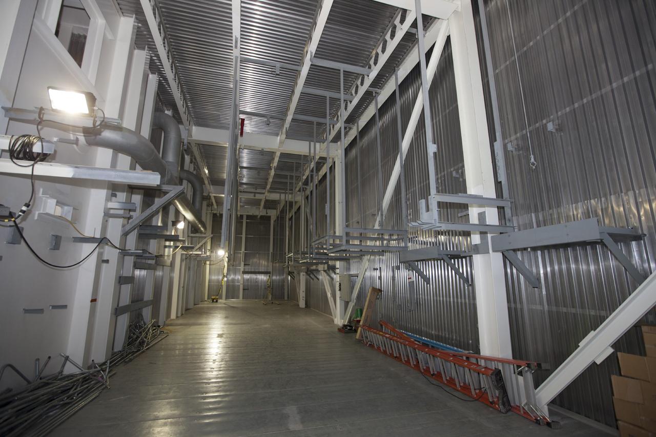 CAPE CANAVERAL, Fla. -- All is quiet and orderly inside the mobile launcher, or ML, at the park site adjacent to the Vehicle Assembly Building, or VAB, at NASA's Kennedy Space Center in Florida.     Preparations are underway for modifications to begin to the outside of the 355-foot-tall ML structure this fall. NASA’s Ground Systems Development and Operations Program, or GSDO, is preparing the ML to support NASA’s Space Launch System, the heavy-lift rocket that will launch astronauts into deep space on future exploration missions. For more information, visit http://www.nasa.gov/exploration/systems/ground/index.html. Photo credit: NASA/Kim Shiflett