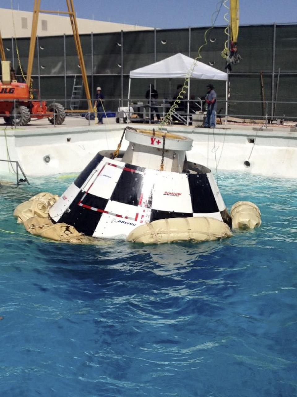 LAS VEGAS, Nev. – A mock-up of The Boeing Company's CST-100 spacecraft floats following the third and final series of simulated contingency water landing scenarios at Bigelow Aerospace's headquarters near Las Vegas. The CST-100 is designed for ground landings, but could splash down on the water, if necessary.       The tests are part of the company’s ongoing work supporting its funded Space Act Agreement with NASA’s Commercial Crew Program, or CCP, during the Commercial Crew Integrated Capability, or CCiCap, initiative. CCP is intended to lead to the availability of commercial human spaceflight services for government and commercial customers to low-Earth orbit. Future development and certification initiatives eventually will lead to the availability of human spaceflight services for NASA to send its astronauts to the International Space Station, where critical research is taking place daily. For more information about CCP, go to http://www.nasa.gov/commercialcrew. Photo credit: Boeing/Kelly George