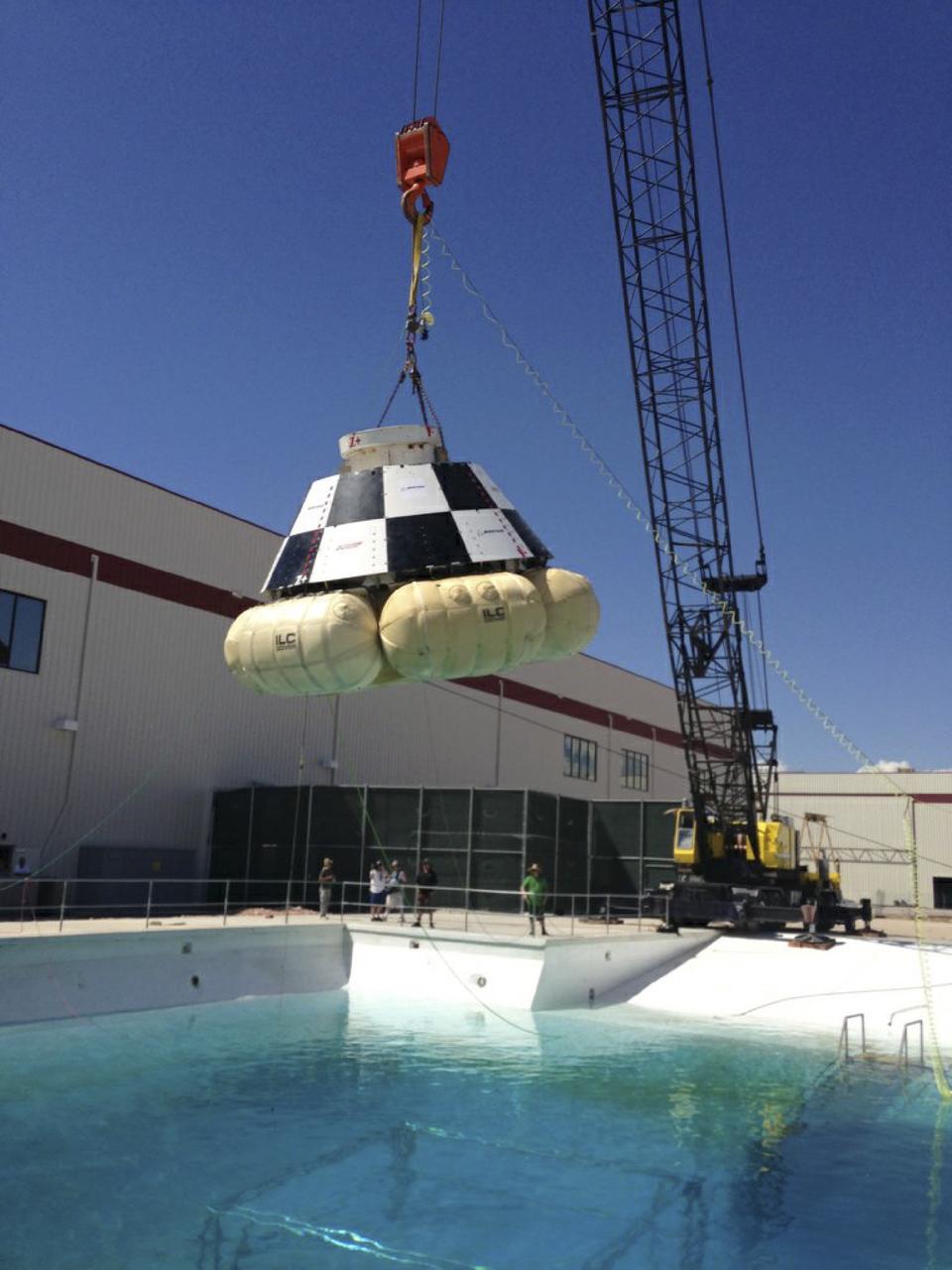 LAS VEGAS, Nev. – A mock-up of The Boeing Company's CST-100 spacecraft is prepared for the third and final series of simulated contingency water landing scenarios at Bigelow Aerospace's headquarters near Las Vegas. The CST-100 is designed for ground landings, but could splash down on the water, if necessary.       The tests are part of the company’s ongoing work supporting its funded Space Act Agreement with NASA’s Commercial Crew Program, or CCP, during the Commercial Crew Integrated Capability, or CCiCap, initiative. CCP is intended to lead to the availability of commercial human spaceflight services for government and commercial customers to low-Earth orbit. Future development and certification initiatives eventually will lead to the availability of human spaceflight services for NASA to send its astronauts to the International Space Station, where critical research is taking place daily. For more information about CCP, go to http://www.nasa.gov/commercialcrew. Photo credit: Boeing/Kelly George