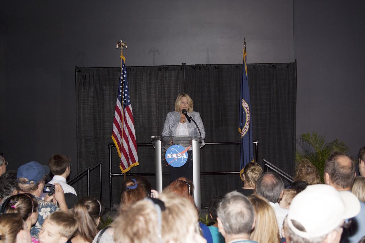CAPE CANAVERAL, Fla. -- Cheryl Hurst, director of NASA Education and External Relations speaks during a ceremony to enshrine a Space Shuttle Program time capsule in a secured vault within the walls of the Space Shuttle Atlantis home at the Kennedy Space Center Visitor Complex.      The time capsule, containing artifacts and other memorabilia associated with the history of the program is designated to be opened on the 50th anniversary of the shuttle's final landing, STS-135. The new $100 million "Space Shuttle Atlantis" facility includes interactive exhibits that tell the story of the 30-year Space Shuttle Program and highlight the future of space exploration. Photo credit: NASA/Jim Grossmann