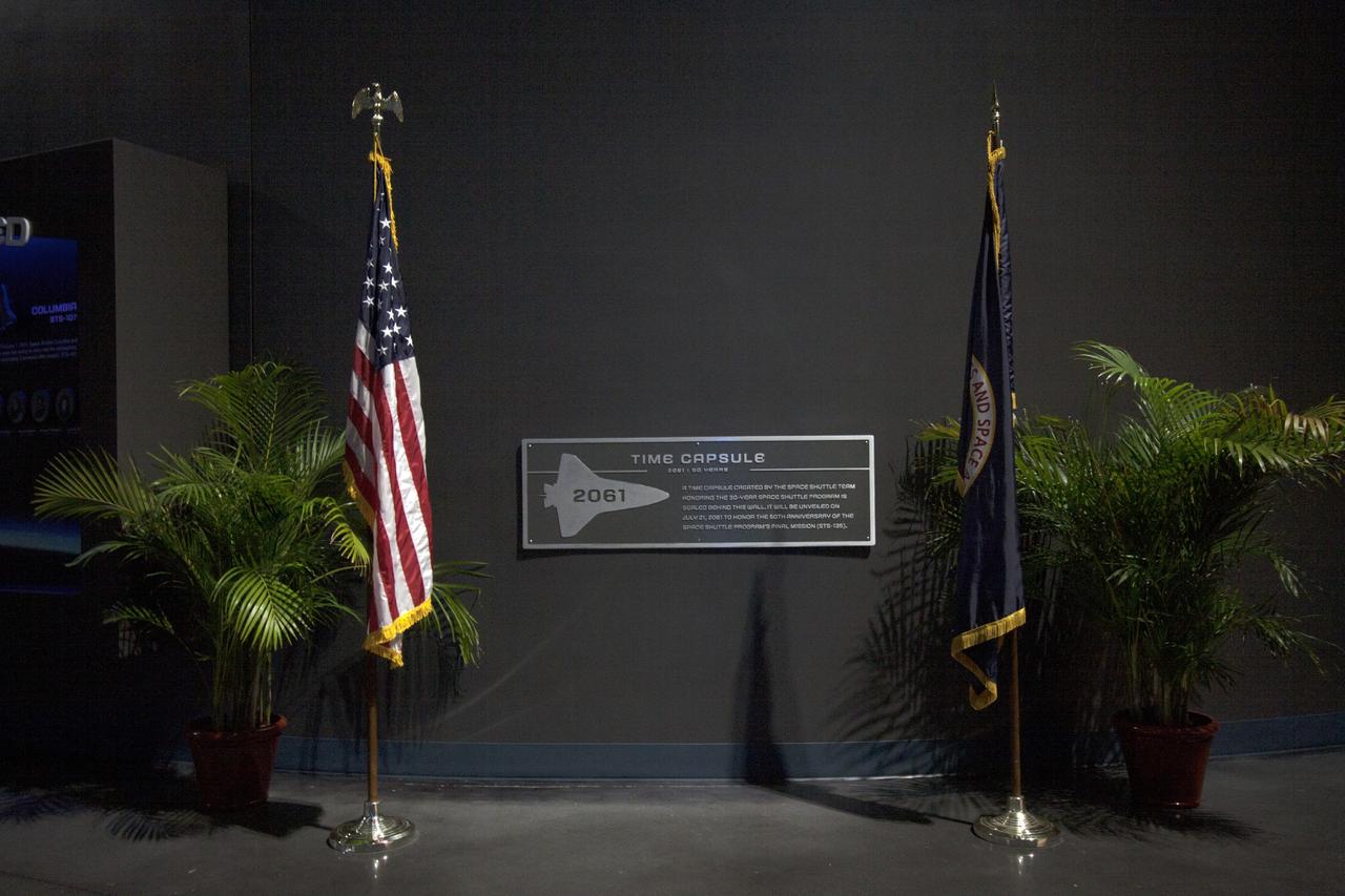 CAPE CANAVERAL, Fla. -- At the Kennedy Space Center Visitor Complex in Florida, a Space Shuttle Program time capsule has been enshrined capsule in a secured vault within the walls of the 90,000-square-foot Space Shuttle Atlantis home. The time capsule, containing artifacts and other memorabilia associated with the history of the program is designated to be opened on the 50th anniversary of the shuttle's final landing, STS-135. The new $100 million "Space Shuttle Atlantis" facility includes interactive exhibits that tell the story of the 30-year Space Shuttle Program and highlight the future of space exploration. Photo credit: NASA/Jim Grossmann