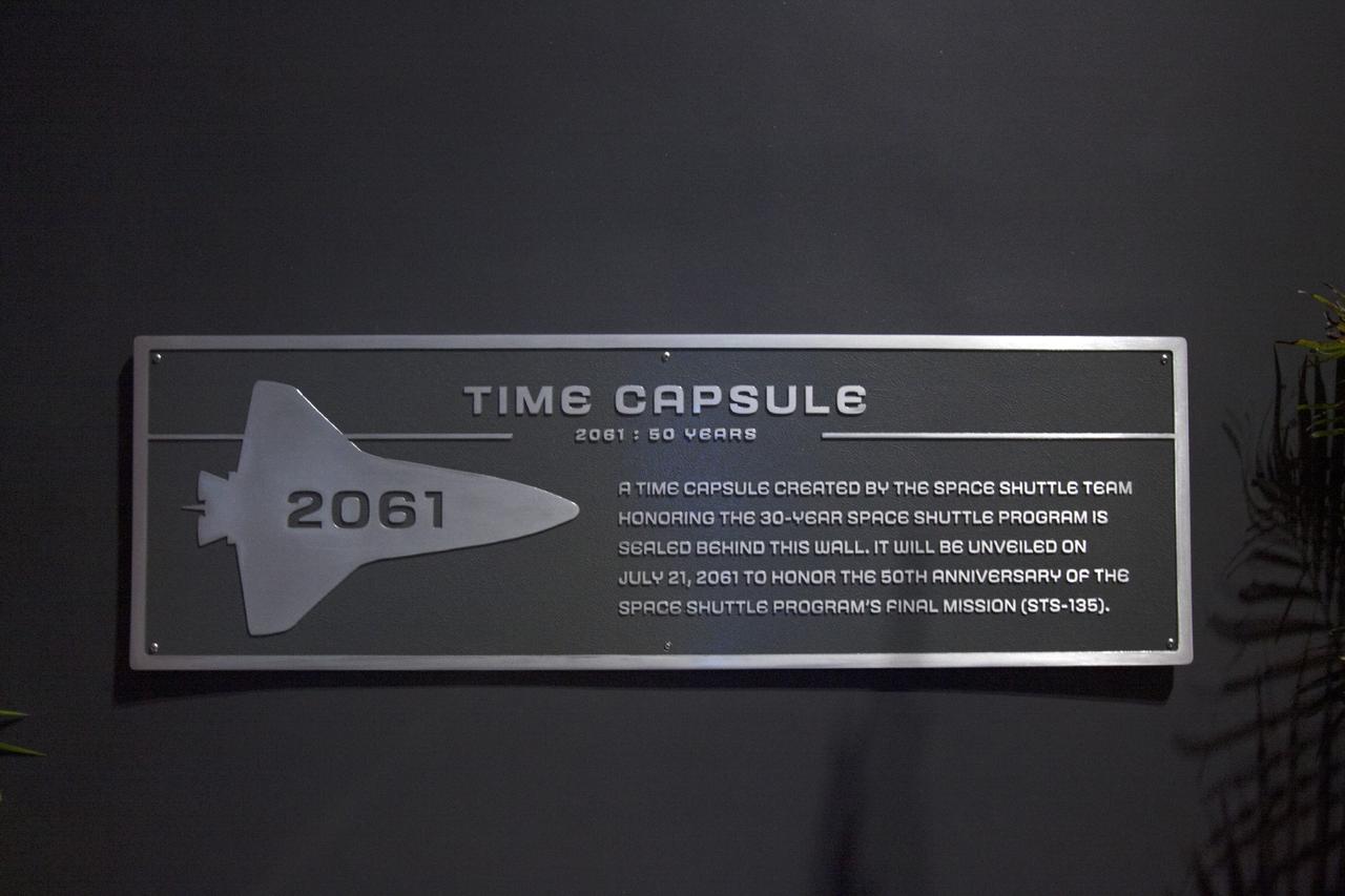 CAPE CANAVERAL, Fla. -- At the Kennedy Space Center Visitor Complex in Florida, a Space Shuttle Program time capsule has been enshrined capsule in a secured vault within the walls of the 90,000-square-foot Space Shuttle Atlantis home. The time capsule, containing artifacts and other memorabilia associated with the history of the program is designated to be opened on the 50th anniversary of the shuttle's final landing, STS-135. The new $100 million "Space Shuttle Atlantis" facility includes interactive exhibits that tell the story of the 30-year Space Shuttle Program and highlight the future of space exploration. Photo credit: NASA/Jim Grossmann