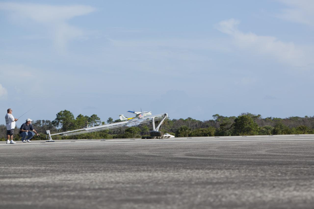CAPE CANAVERAL, Fla. – A remote-controlled aircraft takes off during a competition with a unique set of sensors and software to conduct a mock search-and-rescue operation. The aircraft was assembled by a team of engineers from NASA's Kennedy Space Center. Teams from Johnson Space Center, Kennedy and Marshall Space Flight Center competed in the unmanned aerial systems event to evaluate designs and work by engineers learning new specialties. The competition took place at the Shuttle Landing Facility at Kennedy. Photo credit: NASA/Dmitri Gerondidakis