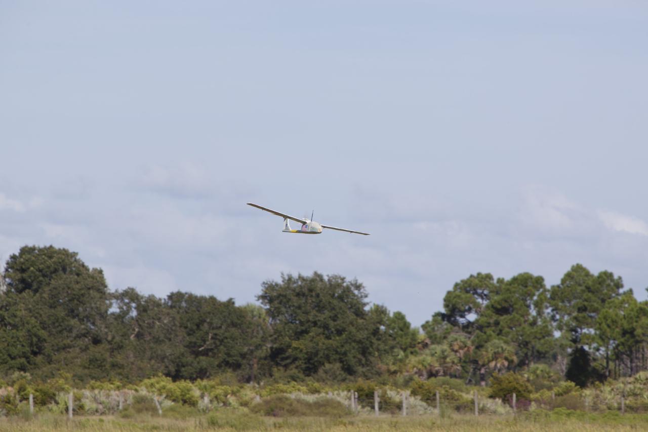 CAPE CANAVERAL, Fla. – A remote-controlled aircraft flies during a competition with a unique set of sensors and software to conduct a mock search-and-rescue operation. The aircraft was assembled by a team of engineers from NASA's Kennedy Space Center. Teams from Johnson Space Center, Kennedy and Marshall Space Flight Center competed in the unmanned aerial systems event to evaluate designs and work by engineers learning new specialties. The competition took place at the Shuttle Landing Facility at Kennedy. Photo credit: NASA/Dmitri Gerondidakis