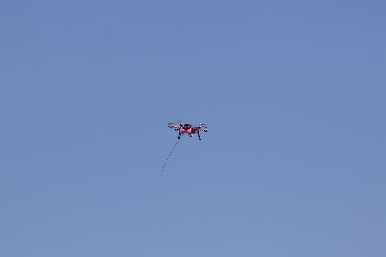 CAPE CANAVERAL, Fla. – A remote-controlled aircraft flies during a competition with a unique set of sensors and software to conduct a mock search-and-rescue operation. The aircraft was assembled by a team of engineers from NASA's Marshall Space Flight Center. Teams from Johnson Space Center, Kennedy Space Center and Marshall competed in the unmanned aerial systems event to evaluate designs and work by engineers learning new specialties. The competition took place at the Shuttle Landing Facility at Kennedy. Photo credit: NASA/Dmitri Gerondidakis