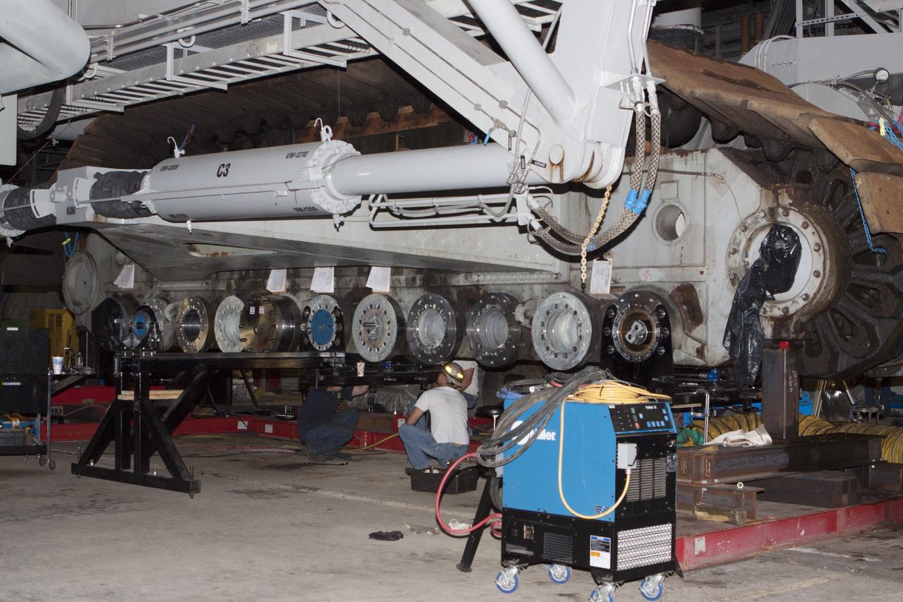 CAPE CANAVERAL, Fla. -- Preparations are underway to install new bearings on crawler-transporter 2 in the Vehicle Assembly Building High Bay 2 at NASA's Kennedy Space Center in Florida.      Modifications underway on the crawler are designed to ensure its ability to transport launch vehicles currently under development, such as the agency’s Space Launch System, to the launch pad. Present modifications represent a redesign and upgrade to the roller bearings and assemblies originally installed on the crawler. The Ground Systems Development and Operations Program office at Kennedy is overseeing the upgrades. For more than 45 years the crawler-transporters were used to transport the mobile launcher platform carrying the Apollo-Saturn V rockets and space shuttles to Launch Pads 39A and 39B. For more information, visit http://www.nasa.gov/exploration/systems/ground/crawler-transporter_bearings_prt.htm. Photo credit: NASA/Kim Shiflett