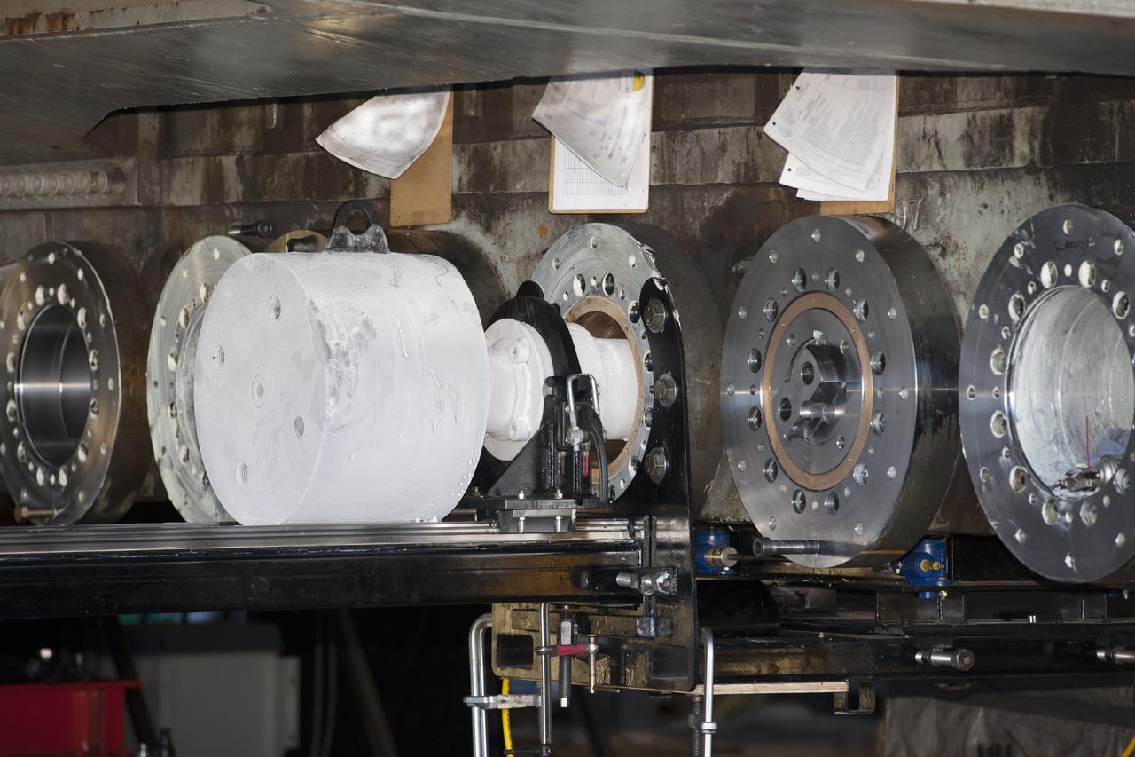 CAPE CANAVERAL, Fla. -- The installation of new bearings on crawler-transporter 2 is underway in Vehicle Assembly Building High Bay 2 at NASA's Kennedy Space Center in Florida.      Modifications underway on the crawler are designed to ensure its ability to transport launch vehicles currently under development, such as the agency’s Space Launch System, to the launch pad. Present modifications represent a redesign and upgrade to the roller bearings and assemblies originally installed on the crawler. The Ground Systems Development and Operations Program office at Kennedy is overseeing the upgrades. For more than 45 years the crawler-transporters were used to transport the mobile launcher platform carrying the Apollo-Saturn V rockets and space shuttles to Launch Pads 39A and 39B. For more information, visit http://www.nasa.gov/exploration/systems/ground/crawler-transporter_bearings_prt.htm. Photo credit: NASA/Kim Shiflett