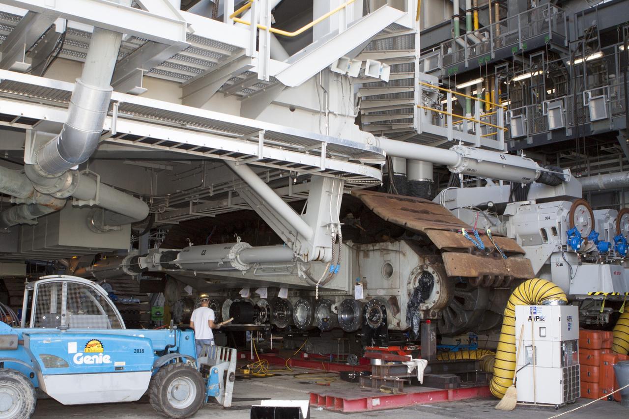 CAPE CANAVERAL, Fla. -- Steady progress is made on the installation of new bearings on crawler-transporter 2 in Vehicle Assembly Building High Bay 2 at NASA's Kennedy Space Center in Florida.      Modifications underway on the crawler are designed to ensure its ability to transport launch vehicles currently under development, such as the agency’s Space Launch System, to the launch pad. Present modifications represent a redesign and upgrade to the roller bearings and assemblies originally installed on the crawler. The Ground Systems Development and Operations Program office at Kennedy is overseeing the upgrades. For more than 45 years the crawler-transporters were used to transport the mobile launcher platform carrying the Apollo-Saturn V rockets and space shuttles to Launch Pads 39A and 39B. For more information, visit http://www.nasa.gov/exploration/systems/ground/crawler-transporter_bearings_prt.htm. Photo credit: NASA/Kim Shiflett