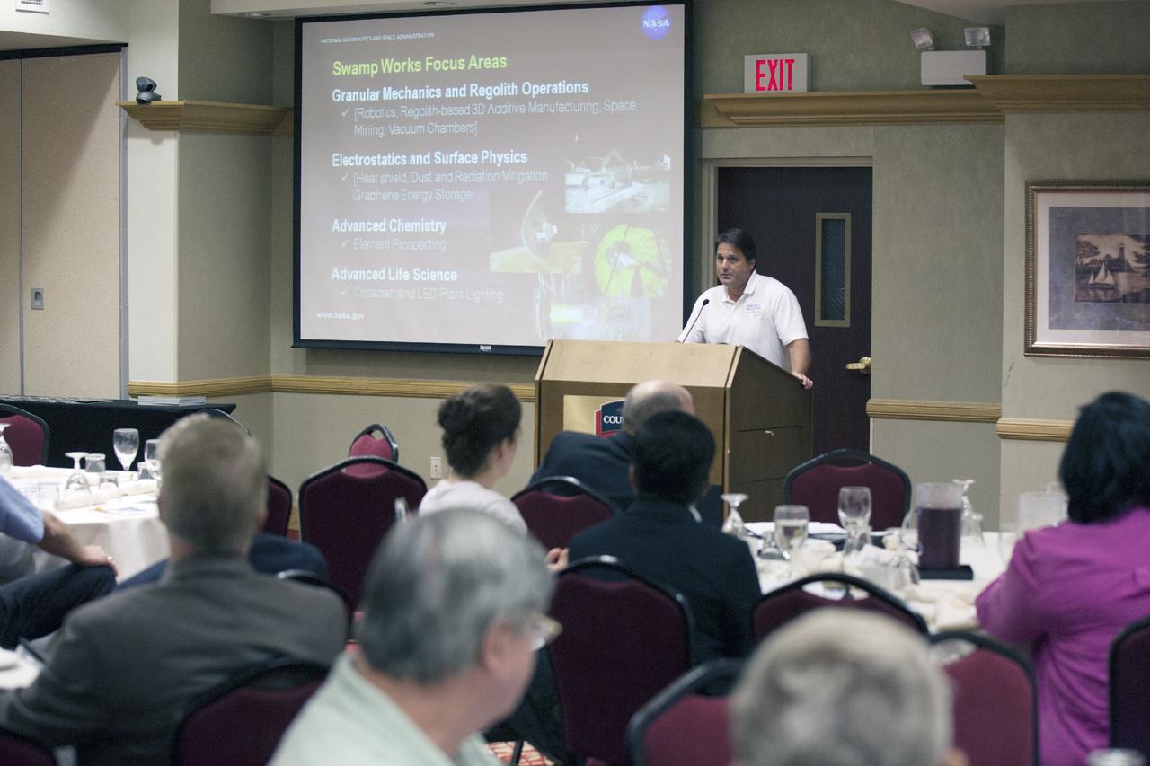 CAPE CANAVERAL, Fla. – Mike Galluzzi, lead business strategist for the Swamp Works at NASA's Kennedy Space Center in Florida, discusses robotics and technology transfer with attendees at the Technology Transfer Forum of the Economic Development Commission of Florida's Space Coast. A goal of the session was to showcase ways commercial businesses can work with NASA to develop technology and apply existing technology to commercial uses. Photo credit: NASA/Glenn Benson