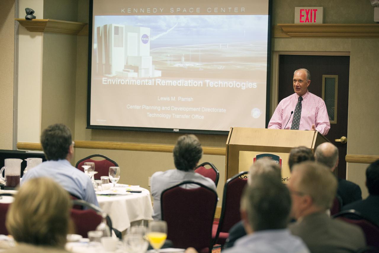 CAPE CANAVERAL, Fla. – Lewis Parrish, senior Technology Transfer specialist for Qinetiq at NASA's Kennedy Space Center in Florida, discusses technology transfer with attendees at the Technology Transfer Forum of the Economic Development Commission of Florida's Space Coast. A goal of the session was to showcase ways commercial businesses can work with NASA to develop technology and apply existing technology to commercial uses. Photo credit: NASA/Glenn Benson