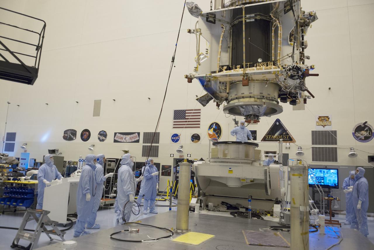 CAPE CANAVERAL, Fla. – Inside the Payload Hazardous Servicing Facility at NASA's Kennedy Space Center in Florida, engineers and technicians use a crane to move the Mars Atmosphere and Volatile Evolution, or MAVEN, spacecraft from a work fixture to a tilt and rotation stand for further pre-flight processing.      MAVEN is being prepared for its scheduled launch in November from Cape Canaveral Air Force Station, Fla. atop a United Launch Alliance Atlas V rocket. Positioned in an orbit above the Red Planet, MAVEN will study the upper atmosphere of Mars in unprecedented detail. For more information, visit: http://www.nasa.gov/mission_pages/maven/main/index.html Photo credit: NASA/ Charisse Nahser