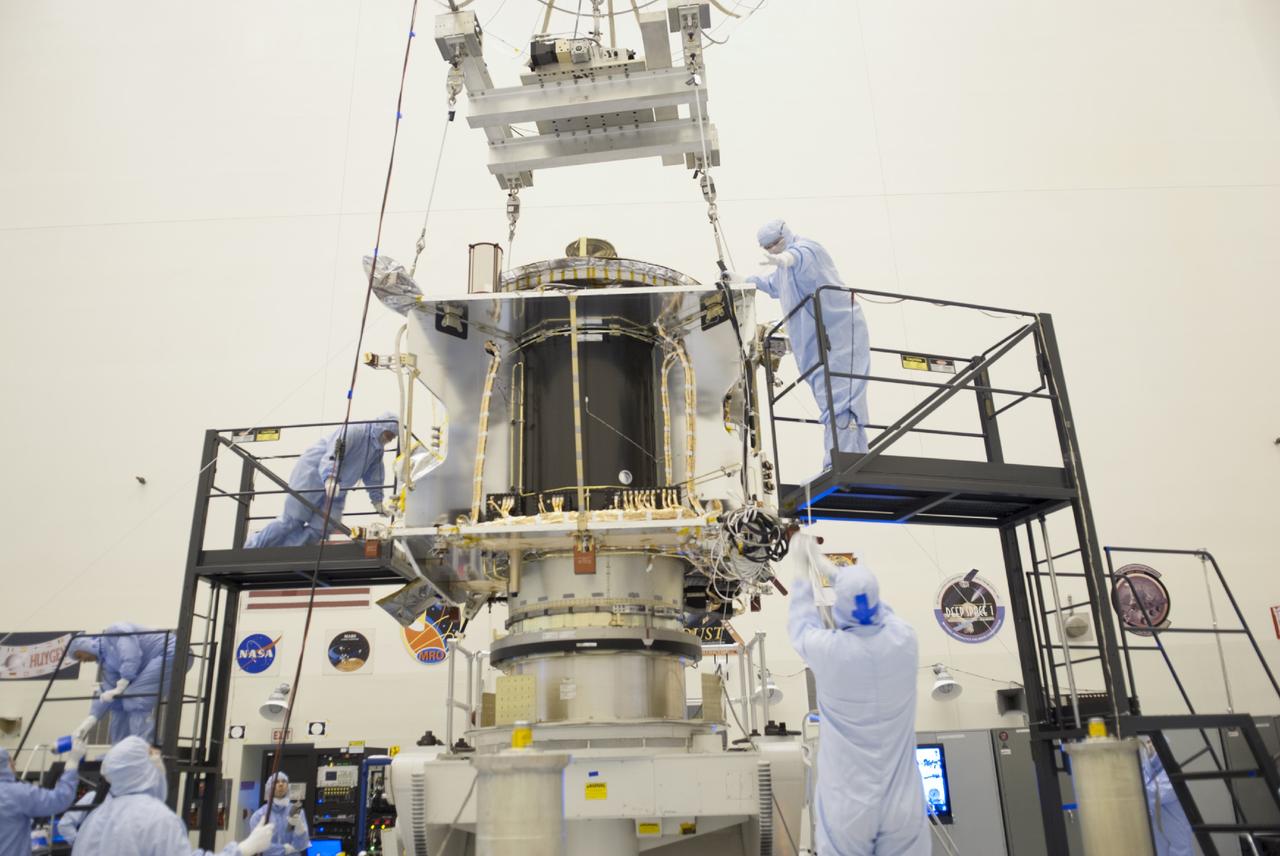 CAPE CANAVERAL, Fla. – Inside the Payload Hazardous Servicing Facility at NASA's Kennedy Space Center in Florida, engineers and technicians use a crane to place the Mars Atmosphere and Volatile Evolution, or MAVEN, spacecraft on a tilt and rotation stand for further pre-flight processing.      MAVEN is being prepared for its scheduled launch in November from Cape Canaveral Air Force Station, Fla. atop a United Launch Alliance Atlas V rocket. Positioned in an orbit above the Red Planet, MAVEN will study the upper atmosphere of Mars in unprecedented detail. For more information, visit: http://www.nasa.gov/mission_pages/maven/main/index.html Photo credit: NASA/ Charisse Nahser