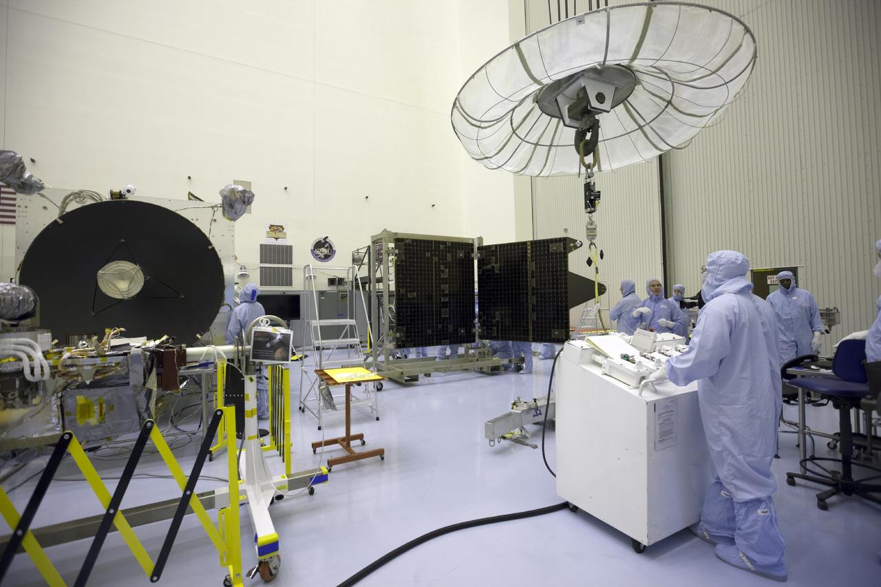 CAPE CANAVERAL, Fla. – Inside the Payload Hazardous Servicing Facility at NASA's Kennedy Space Center in Florida, engineers and technicians prepare to reattach twin solar arrays to the Mars Atmosphere and Volatile Evolution, or MAVEN, spacecraft following inspection and testing.    MAVEN is being prepared for its scheduled launch in November from Cape Canaveral Air Force Station, Fla. atop a United Launch Alliance Atlas V rocket. Positioned in an orbit above the Red Planet, MAVEN will study the upper atmosphere of Mars in unprecedented detail. For more information, visit: http://www.nasa.gov/mission_pages/maven/main/index.html Photo credit: NASA/Kim Shiflett