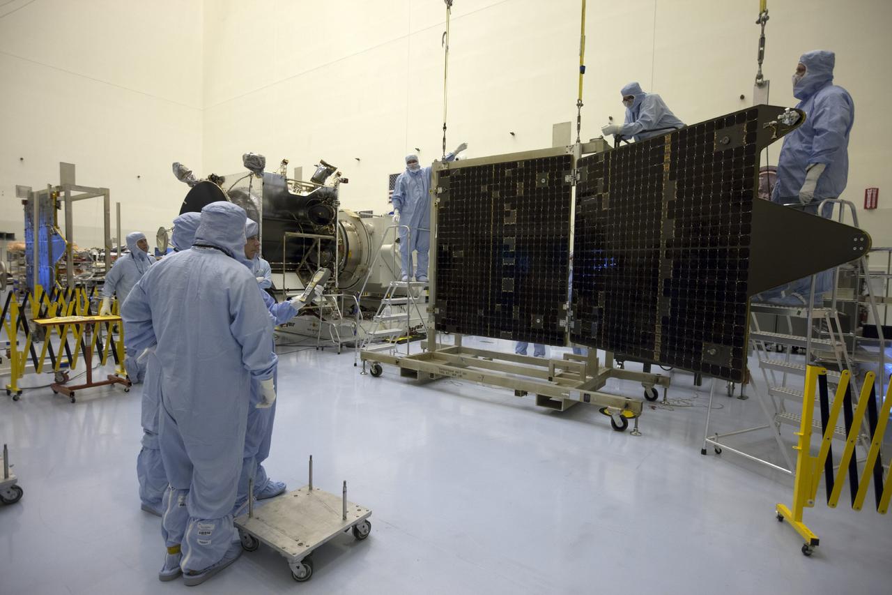 CAPE CANAVERAL, Fla. – Inside the Payload Hazardous Servicing Facility at NASA's Kennedy Space Center in Florida, engineers and technicians reattach twin solar arrays to the Mars Atmosphere and Volatile Evolution, or MAVEN, spacecraft following inspection and testing.      MAVEN is being prepared for its scheduled launch in November from Cape Canaveral Air Force Station, Fla. atop a United Launch Alliance Atlas V rocket. Positioned in an orbit above the Red Planet, MAVEN will study the upper atmosphere of Mars in unprecedented detail. For more information, visit: http://www.nasa.gov/mission_pages/maven/main/index.html Photo credit: NASA/Kim Shiflett