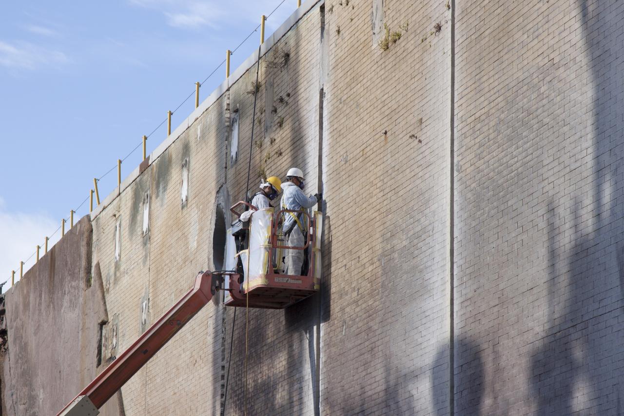 CAPE CANAVERAL, Fla. – At Launch Pad 39B at NASA’s Kennedy Space Center in Florida, construction workers inspect the brick walls of the flame trench area that is located below and between the left and right crawlerway tracks.     Pad B is being refurbished to support NASA’s Space Launch System and other launch vehicles. The Ground Systems Development and Operations, or GSDO, Program at Kennedy is leading the center’s transformation to safely handle a variety of rockets and spacecraft. For more information about GSDO, visit: http://go.nasa.gov/groundsystems.  Photo credit: NASA/Jim Grossman