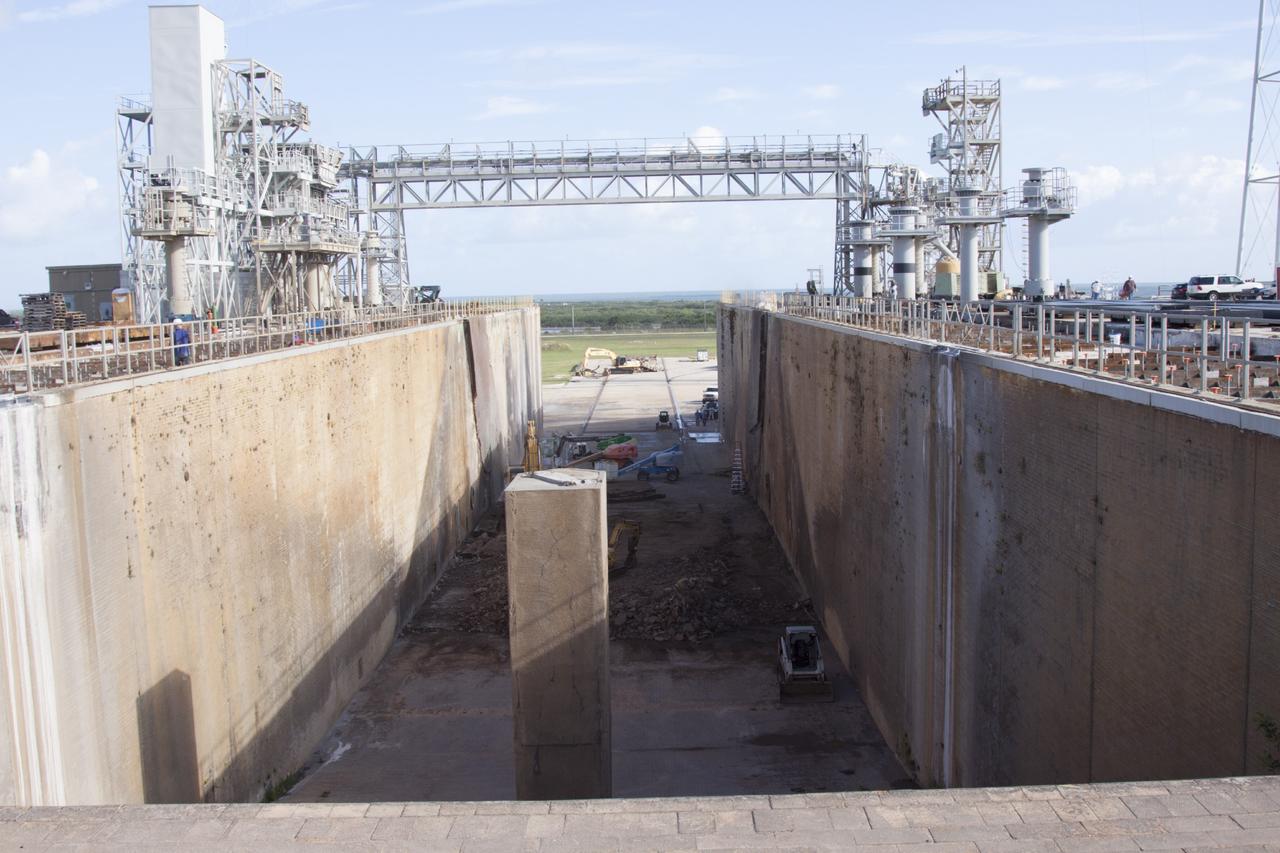 CAPE CANAVERAL, Fla. – At Launch Pad 39B at NASA’s Kennedy Space Center in Florida, the flame trench deflector that was located below and between the left and right crawlerway tracks has been removed.     Pad B is being refurbished to support NASA’s Space Launch System and other launch vehicles. The Ground Systems Development and Operations, or GSDO, Program at Kennedy is leading the center’s transformation to safely handle a variety of rockets and spacecraft. For more information about GSDO, visit: http://go.nasa.gov/groundsystems.  Photo credit: NASA/Jim Grossman
