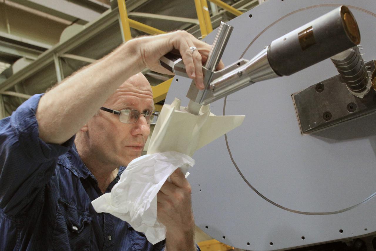 HAMPTON, Va. –A 10-inch long ceramic model of the Sierra Nevada Corporation, or SNC, Dream Chaser spacecraft is prepared for high-speed wind tunnel tests at NASA's Langley Research Center in Hampton, Va. The tests measure how much heat the winged vehicle would experience during ascent and re-entry through the atmosphere, including the spacecraft's lower- and upper-body flaps, elevons and a rudder. They're also helping the company obtain necessary data for the material selection and design of the spacecraft's thermal protection system.    SNC is continuing the development of its Dream Chaser spacecraft under the agency's Commercial Crew Integrated Capability, or CCiCap, initiative, which is intended to lead to the availability of commercial human spaceflight services for government and commercial customers. To learn more about CCP and its industry partners, visit www.nasa.gov/commercialcrew. Image credit: NASA/David Bowman