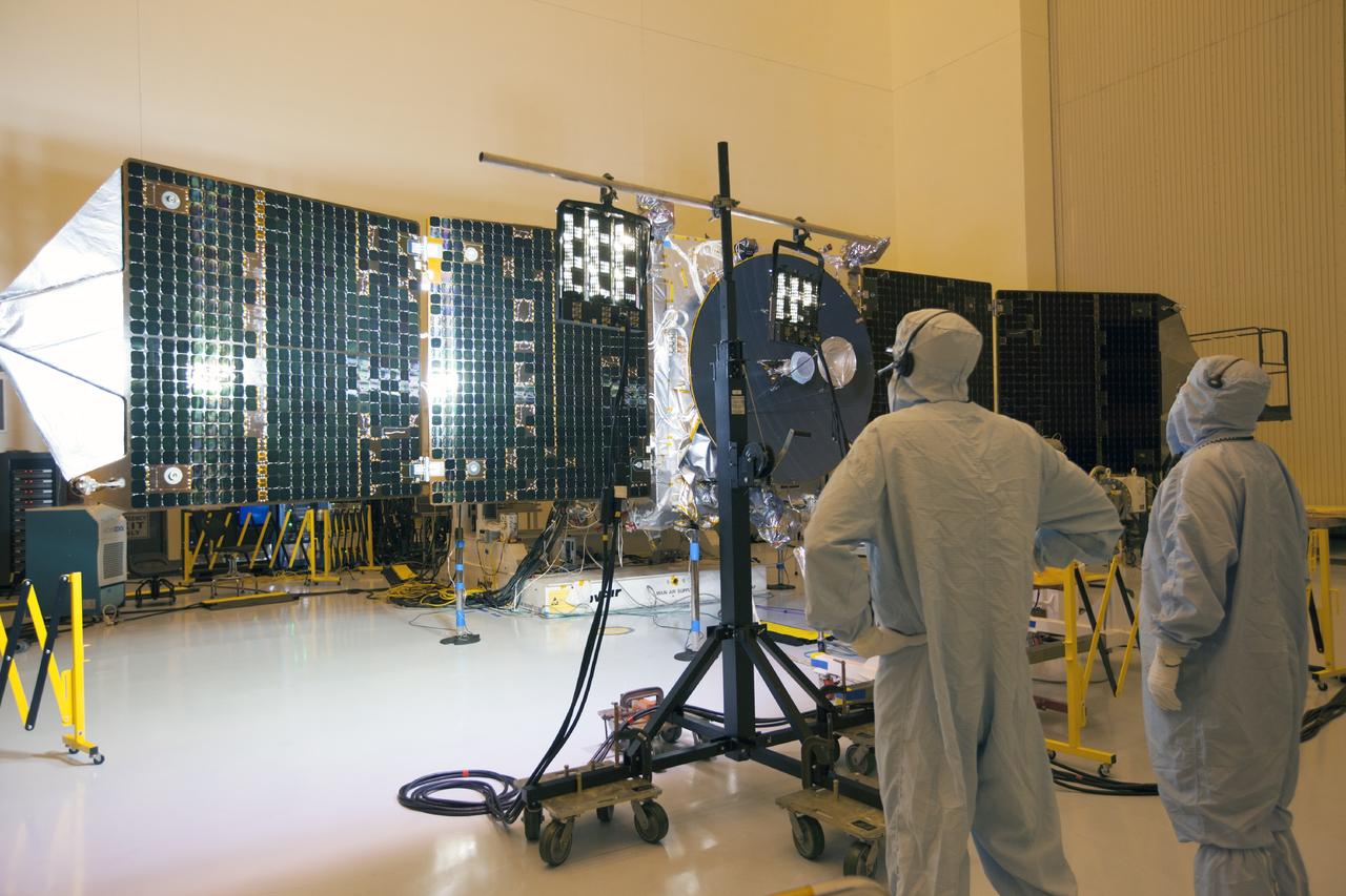 CAPE CANAVERAL, Fla. – Inside the Payload Hazardous Servicing Facility at NASA's Kennedy Space Center in Florida, engineers and technicians use special lighting to test the power-producing capabilities of the twin solar arrays on the Mars Atmosphere and Volatile Evolution, or MAVEN, spacecraft.       MAVEN is being prepared for its scheduled launch in November from Cape Canaveral Air Force Station, Fla. atop a United Launch Alliance Atlas V rocket. Positioned in an orbit above the Red Planet, MAVEN will study the upper atmosphere of Mars in unprecedented detail. For more information, visit: http://www.nasa.gov/mission_pages/maven/main/index.html Photo credit: NASA/Kim Shiflett