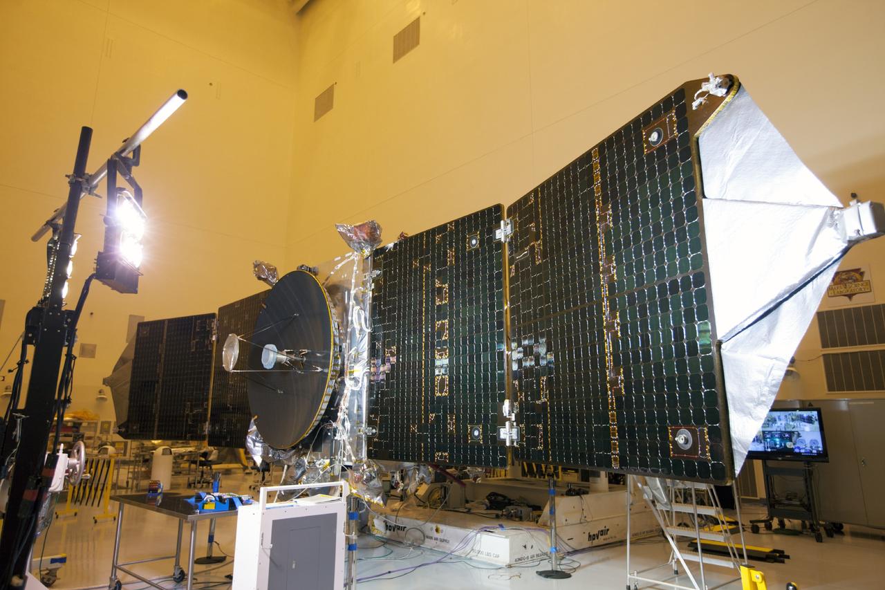 CAPE CANAVERAL, Fla. – Inside the Payload Hazardous Servicing Facility at NASA's Kennedy Space Center in Florida, special lighting is used to test the power-producing capabilities of the twin solar arrays on the Mars Atmosphere and Volatile Evolution, or MAVEN, spacecraft.       MAVEN is being prepared for its scheduled launch in November from Cape Canaveral Air Force Station, Fla. atop a United Launch Alliance Atlas V rocket. Positioned in an orbit above the Red Planet, MAVEN will study the upper atmosphere of Mars in unprecedented detail. For more information, visit: http://www.nasa.gov/mission_pages/maven/main/index.html Photo credit: NASA/Kim Shiflett