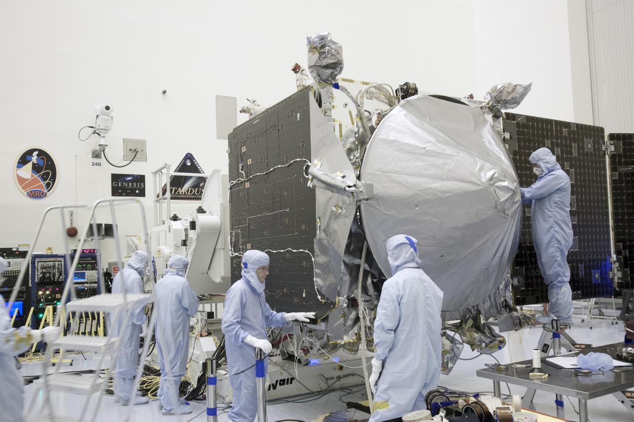 CAPE CANAVERAL, Fla. – Inside the Payload Hazardous Servicing Facility at NASA's Kennedy Space Center in Florida, engineers and technicians install a radome over the antenna for the Mars Atmosphere and Volatile Evolution, or MAVEN, spacecraft. The radome is a coated kapton cover providing thermal protection for the high gain antenna while not interfering with radio frequency transmissions from the spacecraft.          MAVEN is being prepared for its scheduled launch in November from Cape Canaveral Air Force Station, Fla. atop a United Launch Alliance Atlas V rocket. Positioned in an orbit above the Red Planet, MAVEN will study the upper atmosphere of Mars in unprecedented detail. For more information, visit: http://www.nasa.gov/mission_pages/maven/main/index.html Photo credit: NASA/Jim Grossmann
