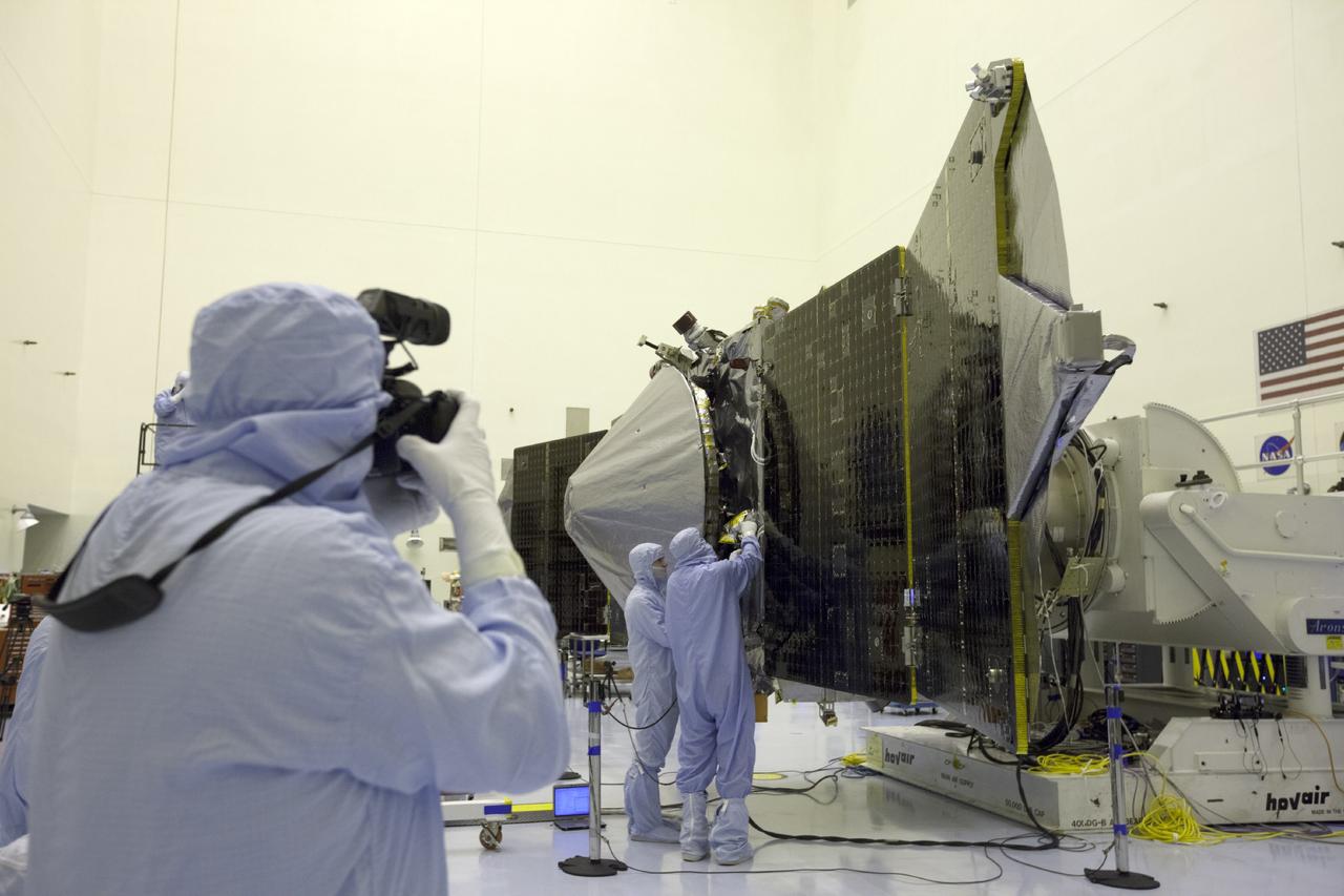 CAPE CANAVERAL, Fla. – Inside the Payload Hazardous Servicing Facility at NASA's Kennedy Space Center in Florida, reporters and photographers look over the Mars Atmosphere and Volatile Evolution, or MAVEN, spacecraft. Members of the news media were given an opportunity to view MAVEN and interview program officials. MAVEN is being prepared for its scheduled launch in November from Cape Canaveral Air Force Station, Fla. atop a United Launch Alliance Atlas V rocket. Positioned in an orbit above the Red Planet, MAVEN will study the upper atmosphere of Mars in unprecedented detail. For more information, visit: http://www.nasa.gov/mission_pages/maven/main/index.html Photo credit: NASA/Kim Shiflett