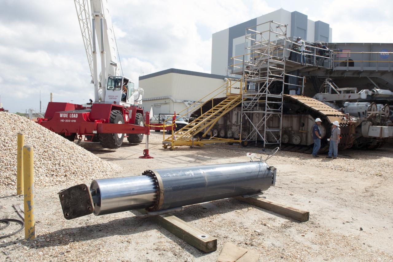 CAPE CANAVERAL, Fla. – One of the jacking, equalizing and leveling, or JEL, hydraulic cylinders has been removed from crawler-transporter 1 at the crawler transporter maintenance facility at NASA’s Kennedy Space Center in Florida. Sixteen new JEL hydraulic cylinders will be installed on CT-1 to increase load carrying capacity and reliability. The Ground Systems Development and Operations Program at Kennedy continues to upgrade CT-1 as part of its general maintenance. CT-1 could be available to carry commercial launch vehicles to the launch pad. The crawler-transporters were used to carry the mobile launcher platform and space shuttle to Launch Complex 39 for space shuttle launches for 30 years. Photo credit: NASA/Tim Jacobs