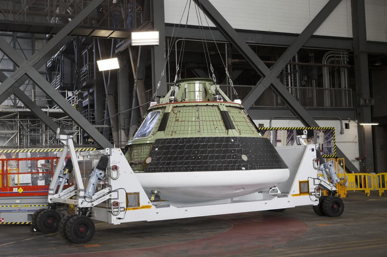 CAPE CANAVERAL, Fla. – At NASA’s Kennedy Space Center in Florida, the Orion ground test vehicle, or GTA, is being prepared for lifting in the transfer aisle of the Vehicle Assembly Building. The GTA is being used for path finding operations, including simulated manufacturing, assembly and stacking procedures. Orion is the exploration spacecraft designed to carry astronauts to destinations not yet explored by humans, including an asteroid and Mars. It will have emergency abort capability, sustain the crew during space travel and provide safe re-entry from deep space return velocities. The first unpiloted test flight of Orion is scheduled to launch in 2014 atop a Delta IV rocket and in 2017 on NASA’s Space Launch System rocket. For more information, visit www.nasa.gov/orion. Photo credit: Dimitri Gerondidakis