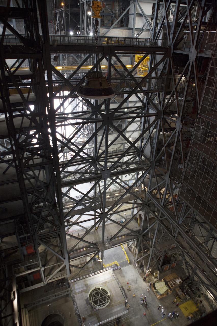 CAPE CANAVERAL, Fla. – At NASA’s Kennedy Space Center in Florida, the Orion ground test vehicle, or GTA, was lifted high in the air by crane in the transfer aisle of the Vehicle Assembly Building and is being lowered toward a mockup of the service module in high bay 4. The ground test vehicle is being used for path finding operations, including simulated manufacturing, assembly and stacking procedures. Orion is the exploration spacecraft designed to carry astronauts to destinations not yet explored by humans, including an asteroid and Mars. It will have emergency abort capability, sustain the crew during space travel and provide safe re-entry from deep space return velocities. The first unpiloted test flight of Orion is scheduled to launch in 2014 atop a Delta IV rocket and in 2017 on NASA’s Space Launch System rocket. For more information, visit www.nasa.gov/orion. Photo credit: Dimitri Gerondidakis