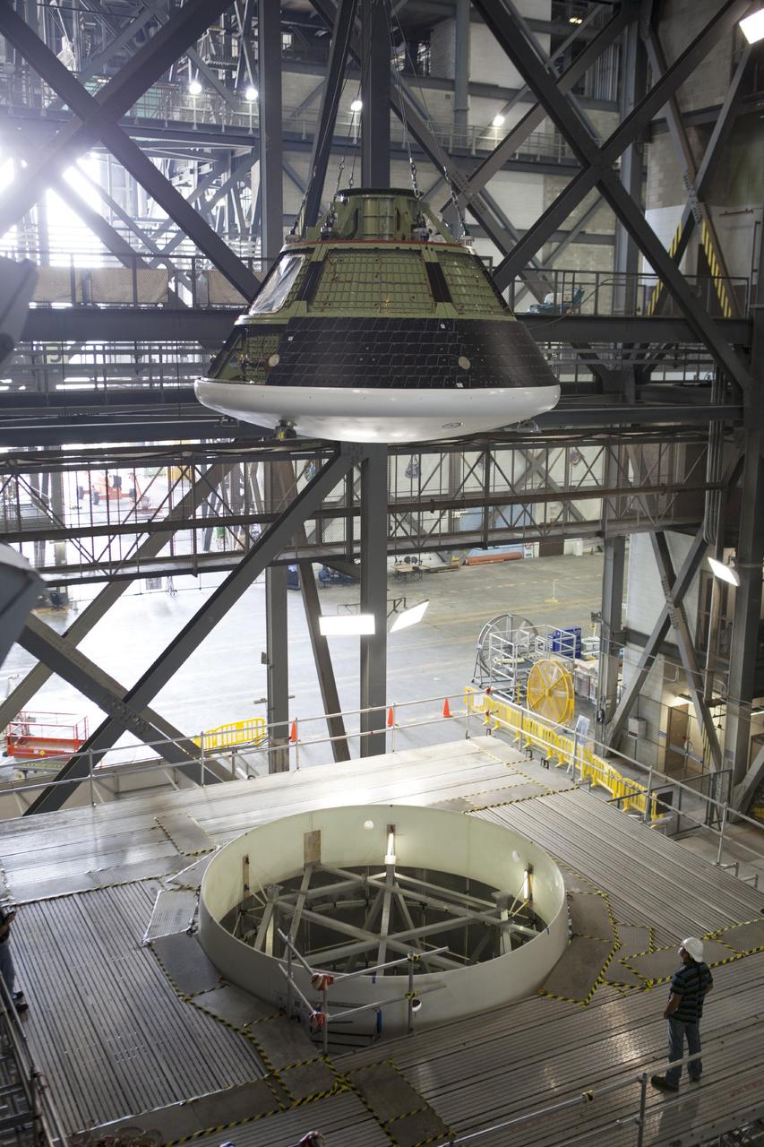 CAPE CANAVERAL, Fla. – At NASA’s Kennedy Space Center in Florida, the Orion ground test vehicle, or GTA, was lifted high in the air by crane in the transfer aisle of the Vehicle Assembly Building and is being lowered toward a mockup of the service module in high bay 4. The ground test vehicle is being used for path finding operations, including simulated manufacturing, assembly and stacking procedures. Orion is the exploration spacecraft designed to carry astronauts to destinations not yet explored by humans, including an asteroid and Mars. It will have emergency abort capability, sustain the crew during space travel and provide safe re-entry from deep space return velocities. The first unpiloted test flight of Orion is scheduled to launch in 2014 atop a Delta IV rocket and in 2017 on NASA’s Space Launch System rocket. For more information, visit www.nasa.gov/orion. Photo credit: Dimitri Gerondidakis
