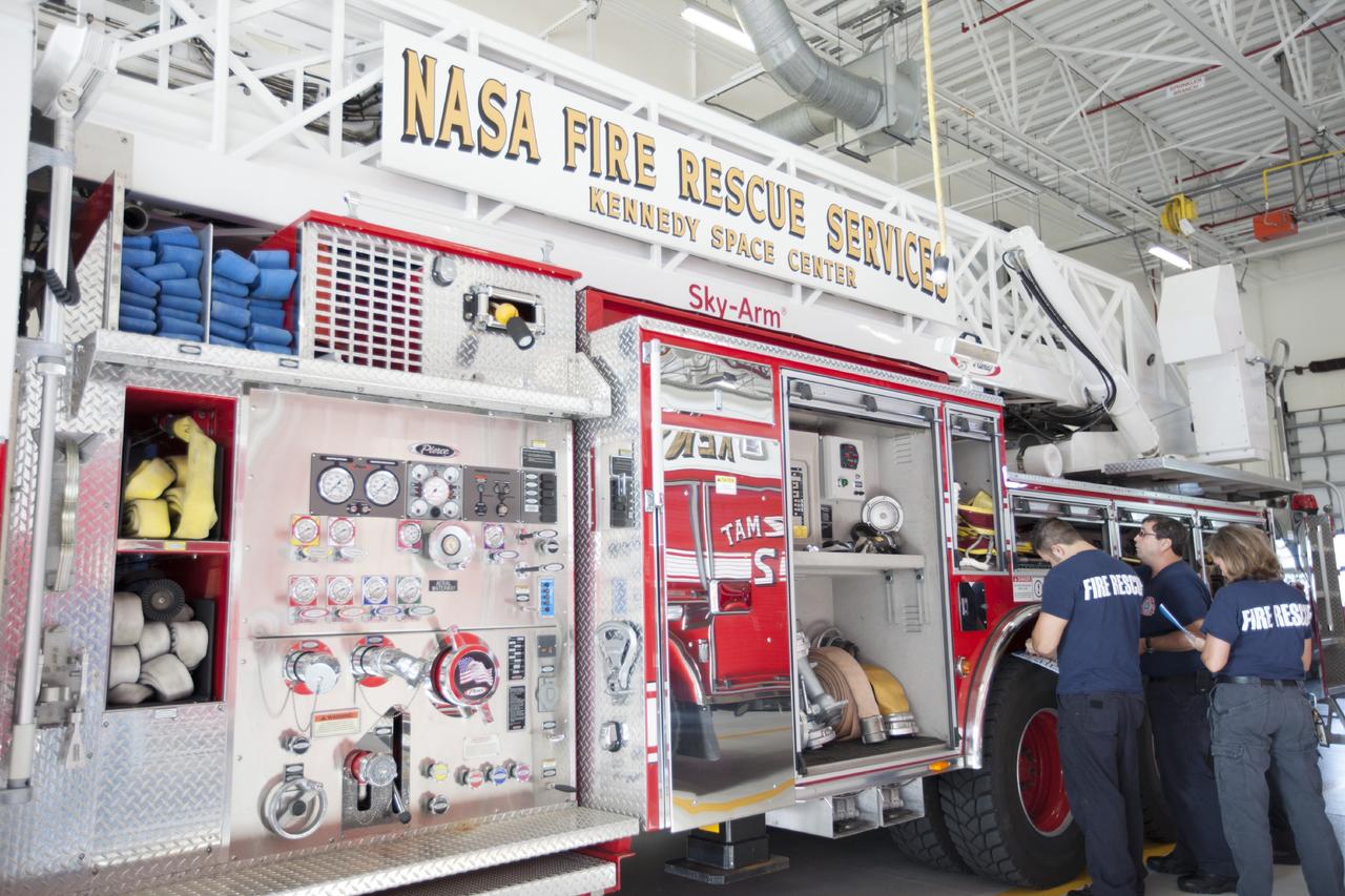 CAPE CANAVERAL, Fla. – At Fire Station No. 2 near the Shuttle Landing Facility at NASA’s Kennedy Space Center in Florida, Fire Rescue Services personnel review procedures and check equipment on the aerial fire truck as part of the training to be certified in the operation and use of the vehicle.    The center’s Fire Rescue Services recently achieved Pro Board Certification in aerial fire truck operations. Pro Board Certification is a globally recognized certification that puts on multiple courses that all fire departments throughout the world recognize and use to train their personnel. The unique aerial truck contains a 100-foot extendable ladder with a bucket at the end of it that can be used for rescues from taller buildings or aircraft rescue firefighting. Photo credit: NASA/Kim Shiflett
