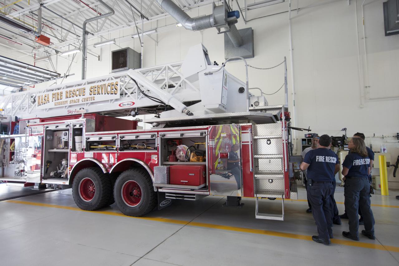CAPE CANAVERAL, Fla. – At Fire Station No. 2 near the Shuttle Landing Facility at NASA’s Kennedy Space Center in Florida, Fire Rescue Services personnel review procedures and check equipment on the aerial fire truck as part of the training to be certified in the operation and use of the vehicle.    The center’s Fire Rescue Services recently achieved Pro Board Certification in aerial fire truck operations. Pro Board Certification is a globally recognized certification that puts on multiple courses that all fire departments throughout the world recognize and use to train their personnel. The unique aerial truck contains a 100-foot extendable ladder with a bucket at the end of it that can be used for rescues from taller buildings or aircraft rescue firefighting. Photo credit: NASA/Kim Shiflett