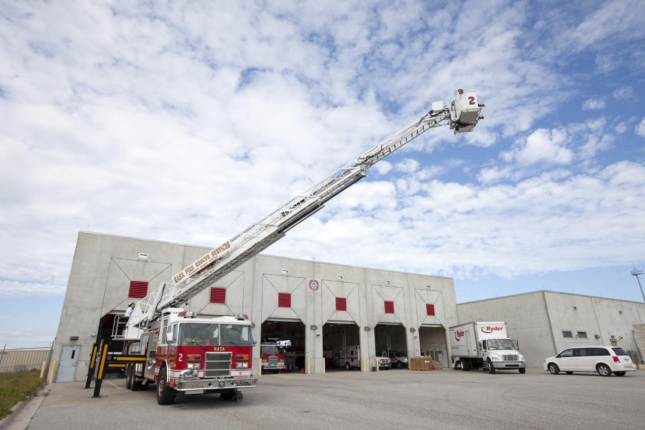 CAPE CANAVERAL, Fla. – At Fire Station No. 2 near the Shuttle Landing Facility at NASA’s Kennedy Space Center in Florida, Fire Rescue Services personnel have deployed and extended the ladder on the aerial fire truck during training in order to be certified in the operation and use of the vehicle.    The center’s Fire Rescue Services recently achieved Pro Board Certification in aerial fire truck operations. Pro Board Certification is a globally recognized certification that puts on multiple courses that all fire departments throughout the world recognize and use to train their personnel. The unique aerial truck contains a 100-foot extendable ladder with a bucket at the end of it that can be used for rescues from taller buildings or aircraft rescue firefighting. Photo credit: NASA/Kim Shiflett