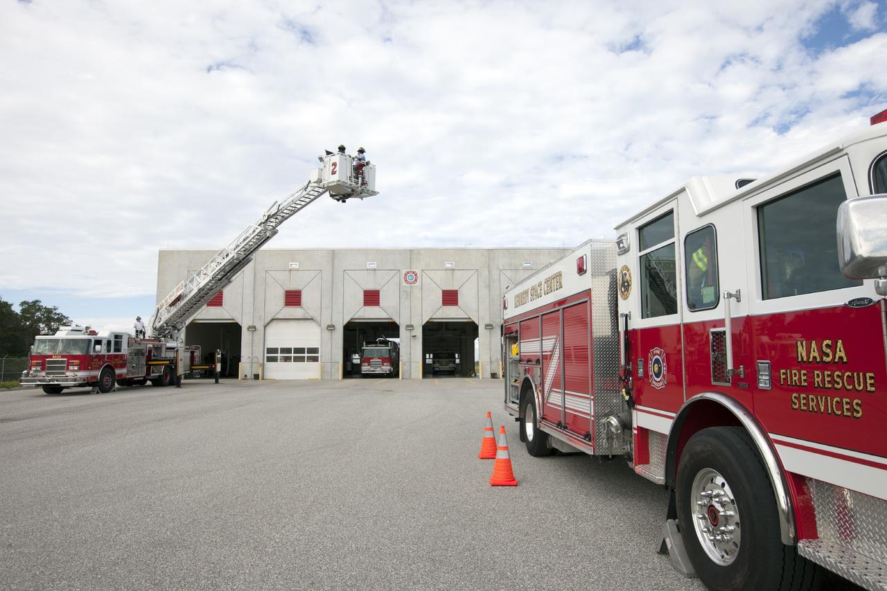 CAPE CANAVERAL, Fla. – At Fire Station No. 2 near the Shuttle Landing Facility at NASA’s Kennedy Space Center in Florida, Fire Rescue Services personnel have deployed and extended the ladder on the aerial fire truck during training in order to be certified in the operation and use of the vehicle. Two fire rescue workers are in the bucket practicing harness procedures.    The center’s Fire Rescue Services recently achieved Pro Board Certification in aerial fire truck operations. Pro Board Certification is a globally recognized certification that puts on multiple courses that all fire departments throughout the world recognize and use to train their personnel. The unique aerial truck contains a 100-foot extendable ladder with a bucket at the end of it that can be used for rescues from taller buildings or aircraft rescue firefighting. Photo credit: NASA/Kim Shiflett