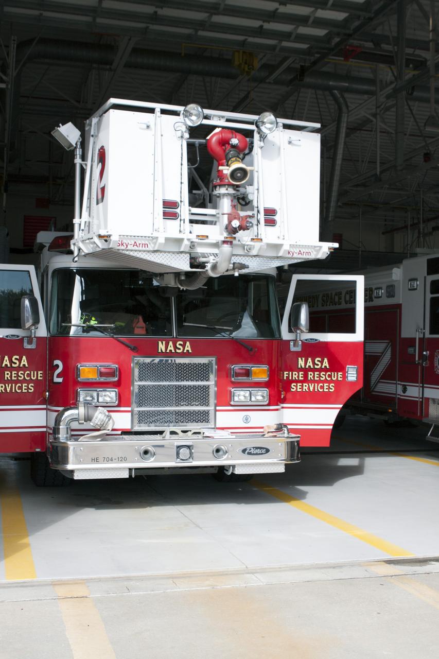 CAPE CANAVERAL, Fla. – At Fire Station No. 2 near the Shuttle Landing Facility at NASA’s Kennedy Space Center in Florida, the aerial fire truck sits in a bay as Fire Rescue Services personnel prepare to drive the fire truck out of the bay and then operate the extendable ladder during training in order to be certified in the operation and use of the vehicle.    The center’s Fire Rescue Services recently achieved Pro Board Certification in aerial fire truck operations. Pro Board Certification is a globally recognized certification that puts on multiple courses that all fire departments throughout the world recognize and use to train their personnel. The unique aerial truck contains a 100-foot extendable ladder with a bucket at the end of it that can be used for rescues from taller buildings or aircraft rescue firefighting. Photo credit: NASA/Kim Shiflett