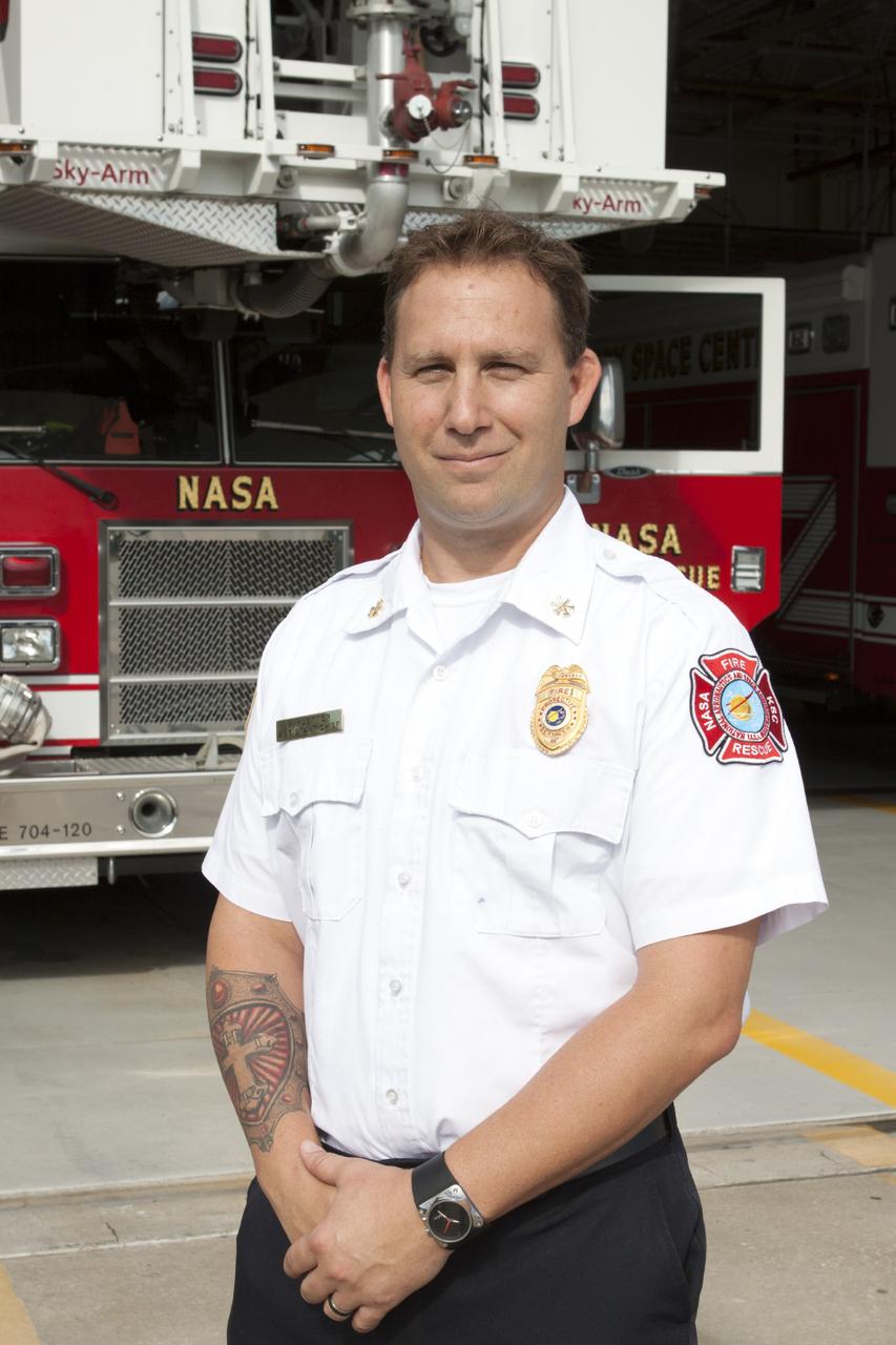 CAPE CANAVERAL, Fla. – At Fire Station No. 2 near the Shuttle Landing Facility at NASA’s Kennedy Space Center in Florida, Mark Huetter, assistant chief of training with the center’s Fire Department, prepares to train Fire Rescue Services personnel in the operation and use of the aerial fire truck.    The center’s Fire Rescue Services recently achieved Pro Board Certification in aerial fire truck operations. Pro Board Certification is a globally recognized certification that puts on multiple courses that all fire departments throughout the world recognize and use to train their personnel. The unique aerial truck contains a 100-foot extendable ladder with a bucket at the end of it that can be used for rescues from taller buildings or aircraft rescue firefighting. Photo credit: NASA/Kim Shiflett