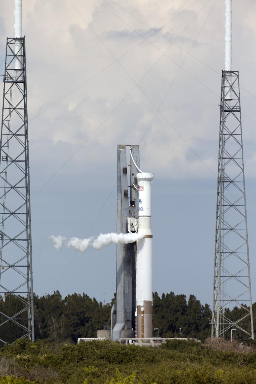 CAPE CANAVERAL, Fla. – The United Launch Alliance Atlas V rocket stands at Launch Complex 41 on Cape Canaveral Air Force Station in Florida during a "wet dress rehearsal." The test called for the launch vehicle to be fully loaded with propellants and put through a countdown procedure, ending just before the T-0 mark. The spacecraft is undergoing prelaunch processing activities in the Kennedy Space Center's Payload Hazardous Servicing Facility and was not atop the rocket for this rehearsal. The Atlas V rocket is slated to launch the Mars Atmosphere and Volatile Evolution, or MAVEN, spacecraft on a journey to the Red Planet on Nov. 18. The spacecraft is undergoing prelaunch processing activities in the Kennedy Space Center's Payload Hazardous Servicing Facility and was not atop the rocket for this rehearsal. Positioned in an orbit above the Red Planet, MAVEN will study the upper atmosphere of Mars in unprecedented detail. For more information, visit: http://www.nasa.gov/mission_pages/maven/main/index.html Photo credit: NASA/Daniel Cooper